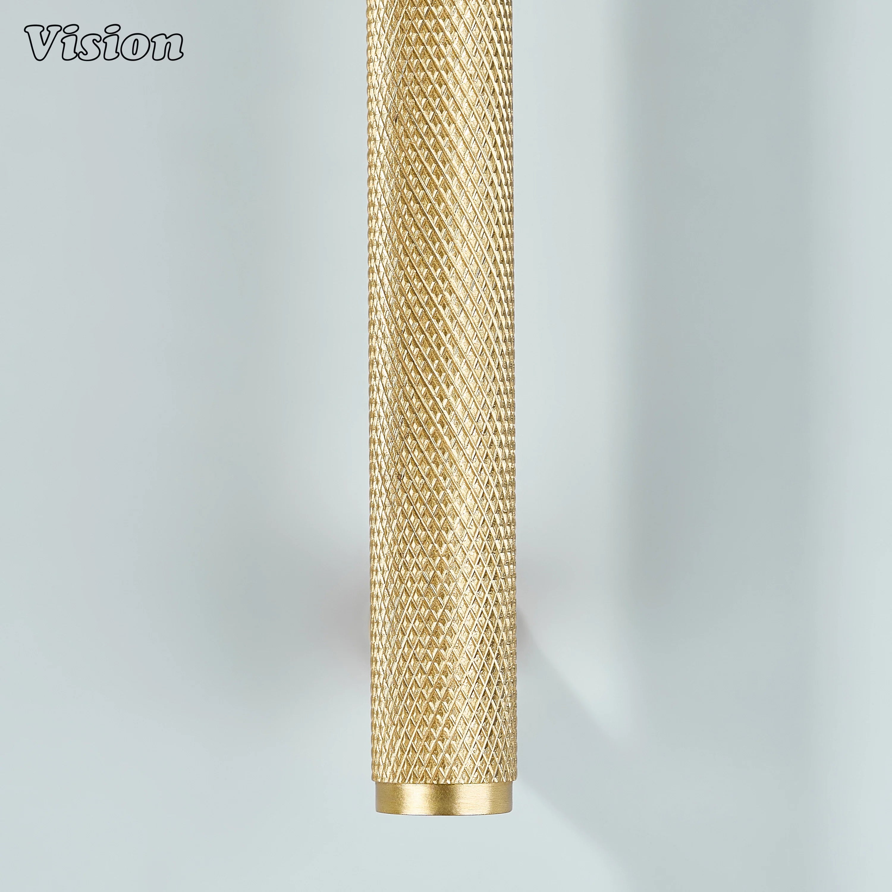Gold textured cabinet pull installed on modular kitchen units.