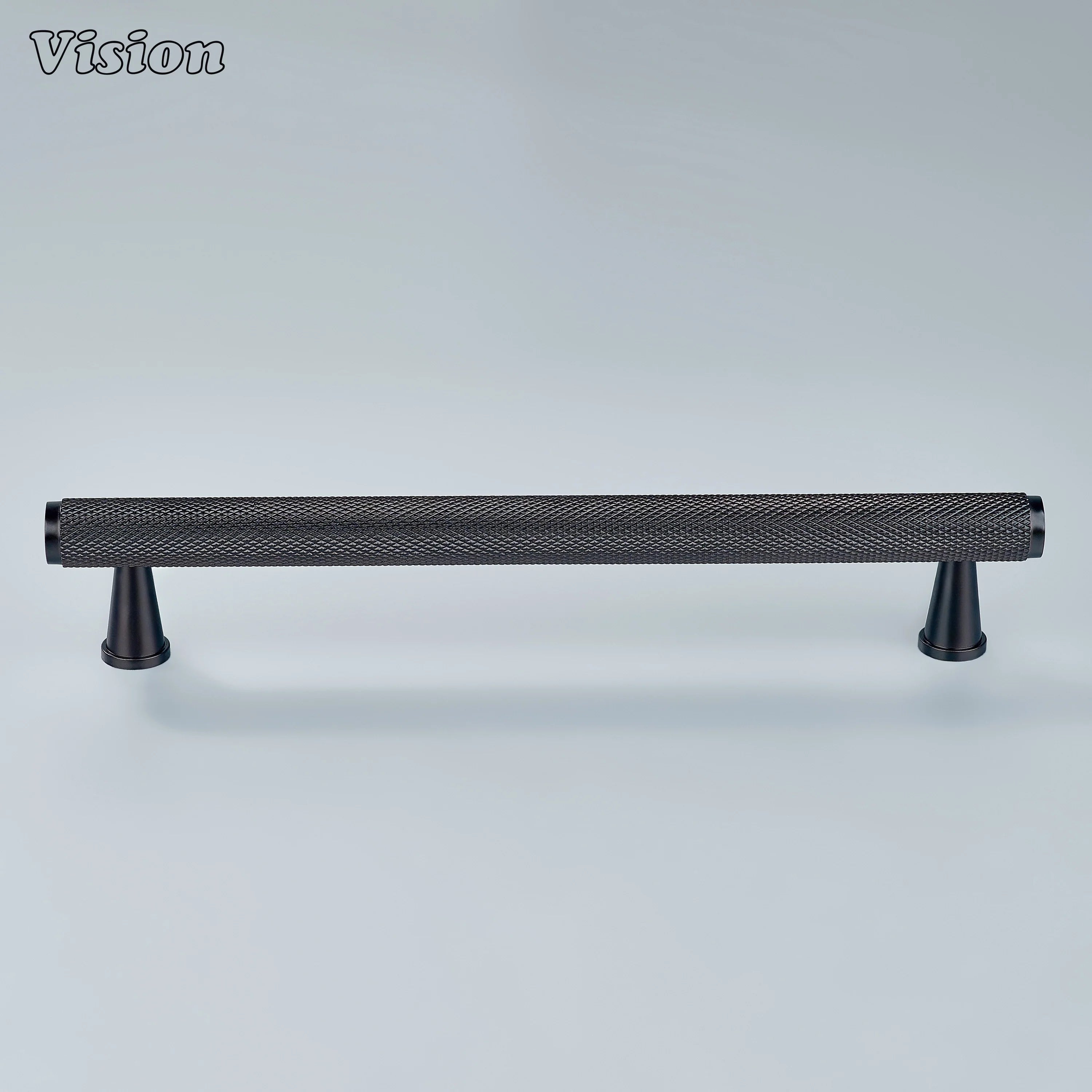Oil rubbed bronze knurled pull installed on cupboards.