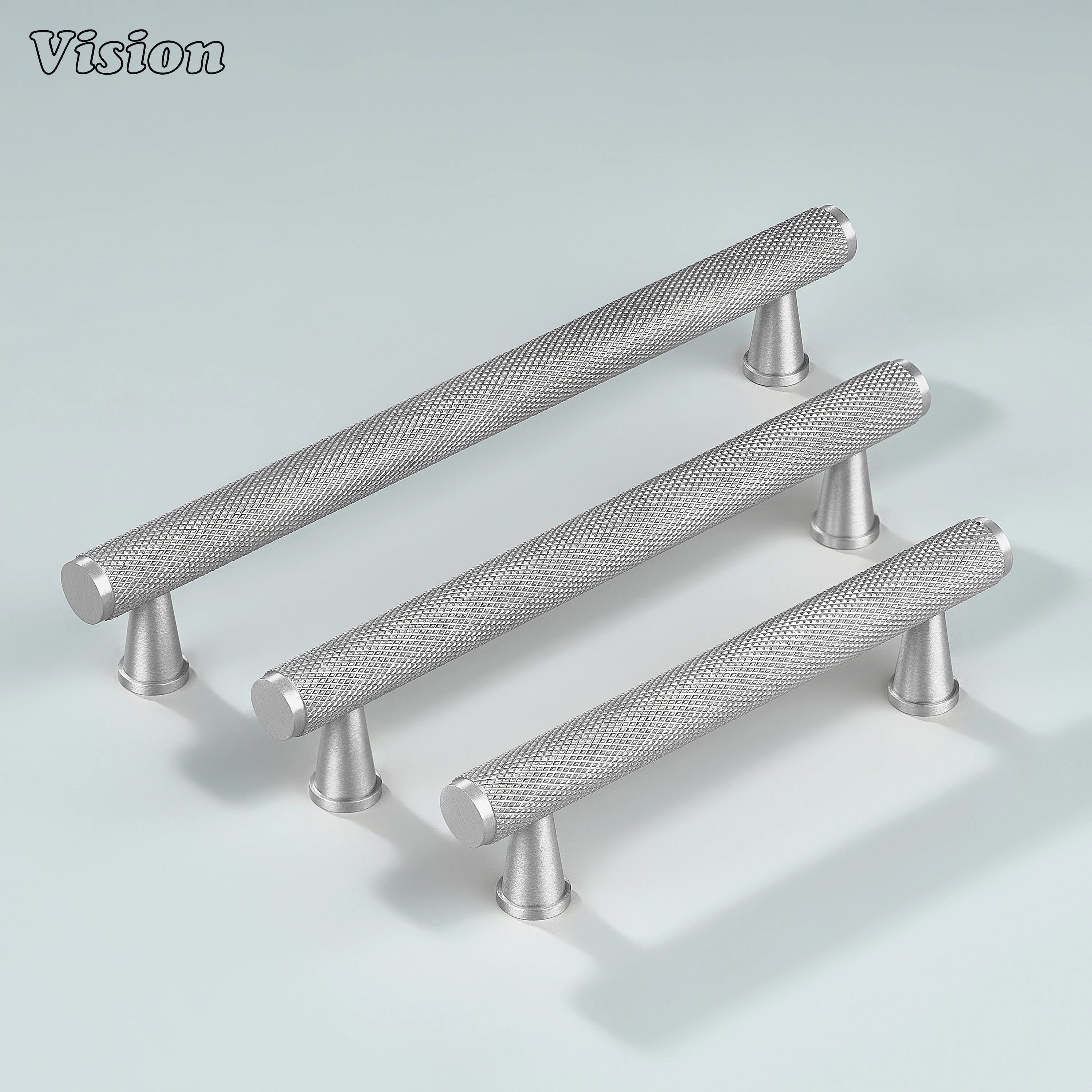 Silver knurled handle used on wardrobe doors.