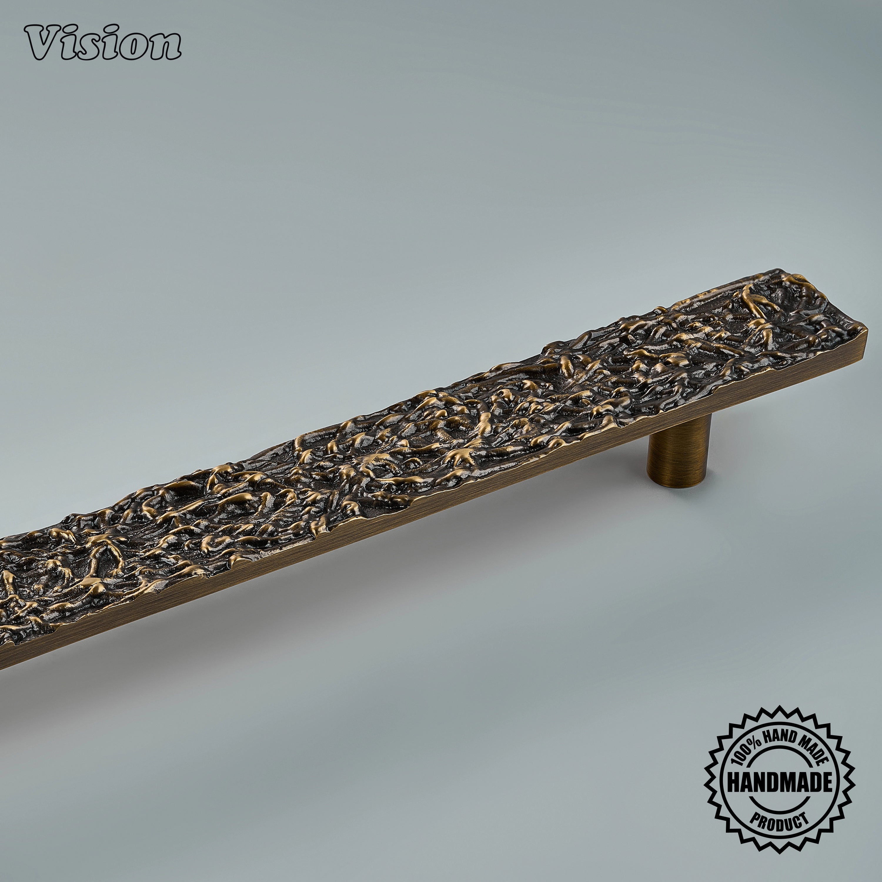 Premium antique bronze sculpted brass pull with round mounting posts on integrated dishwashers
