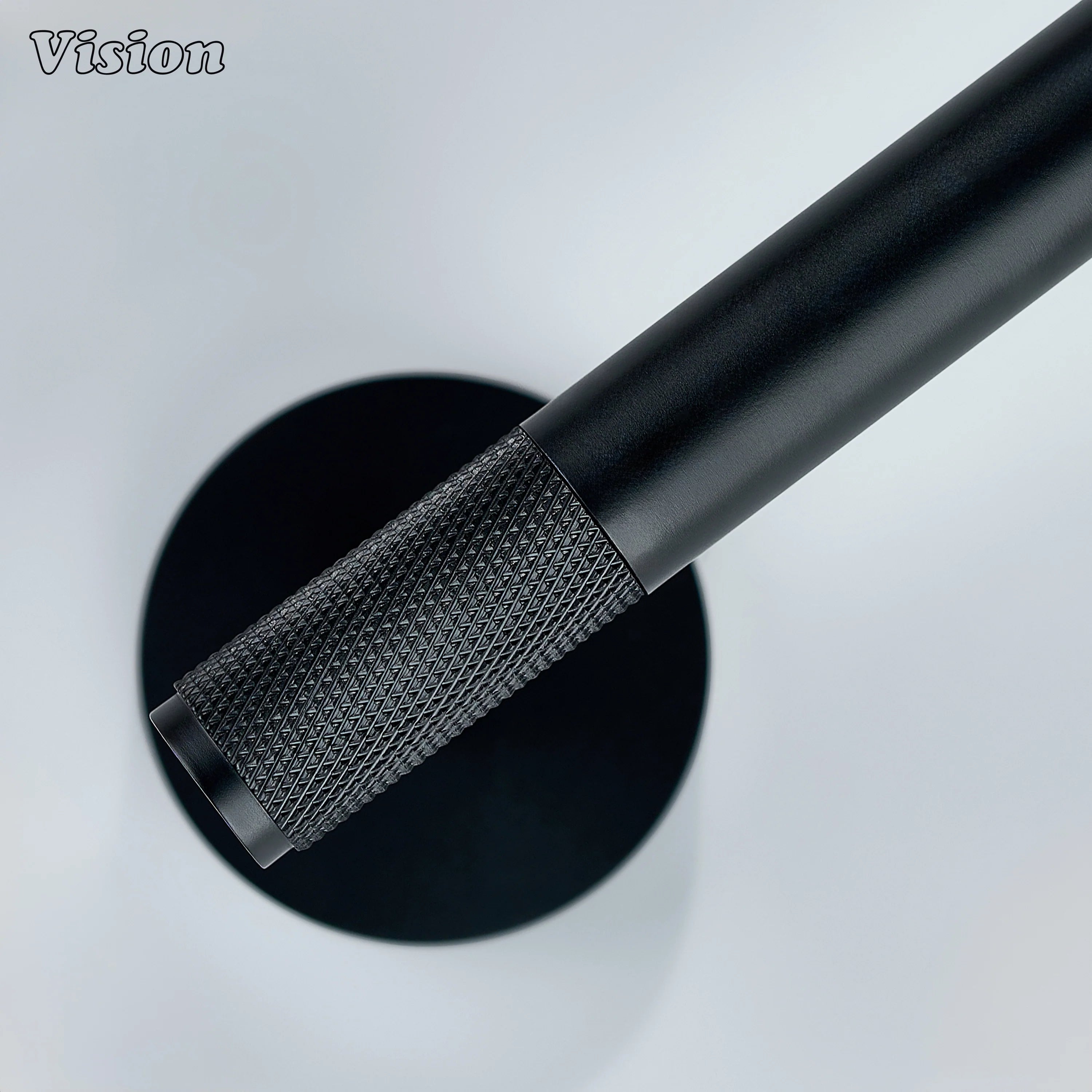 Black brass toilet paper holder with textured bar for bathrooms
