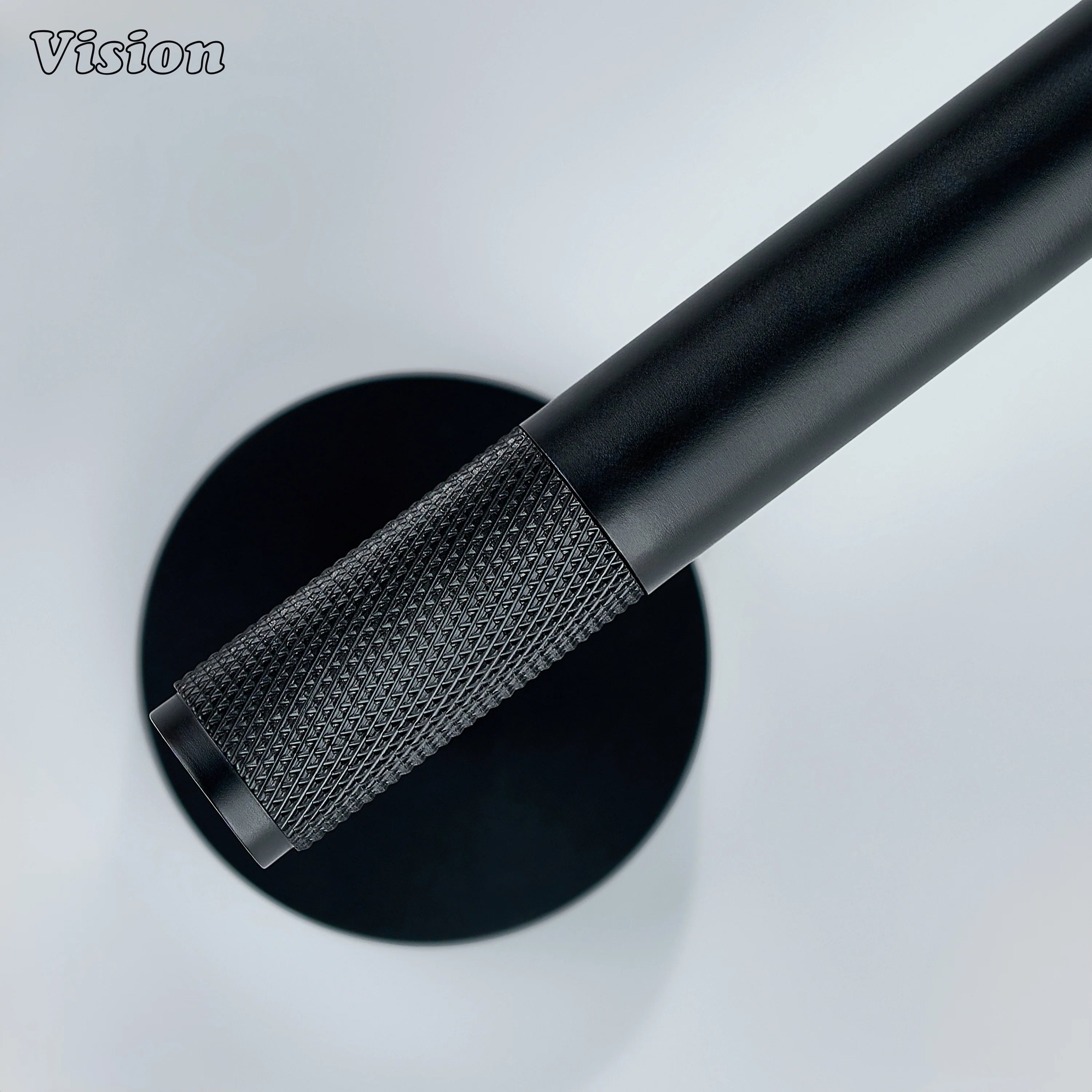 Black brass towel holder with cylindrical bar and knurled grip detail