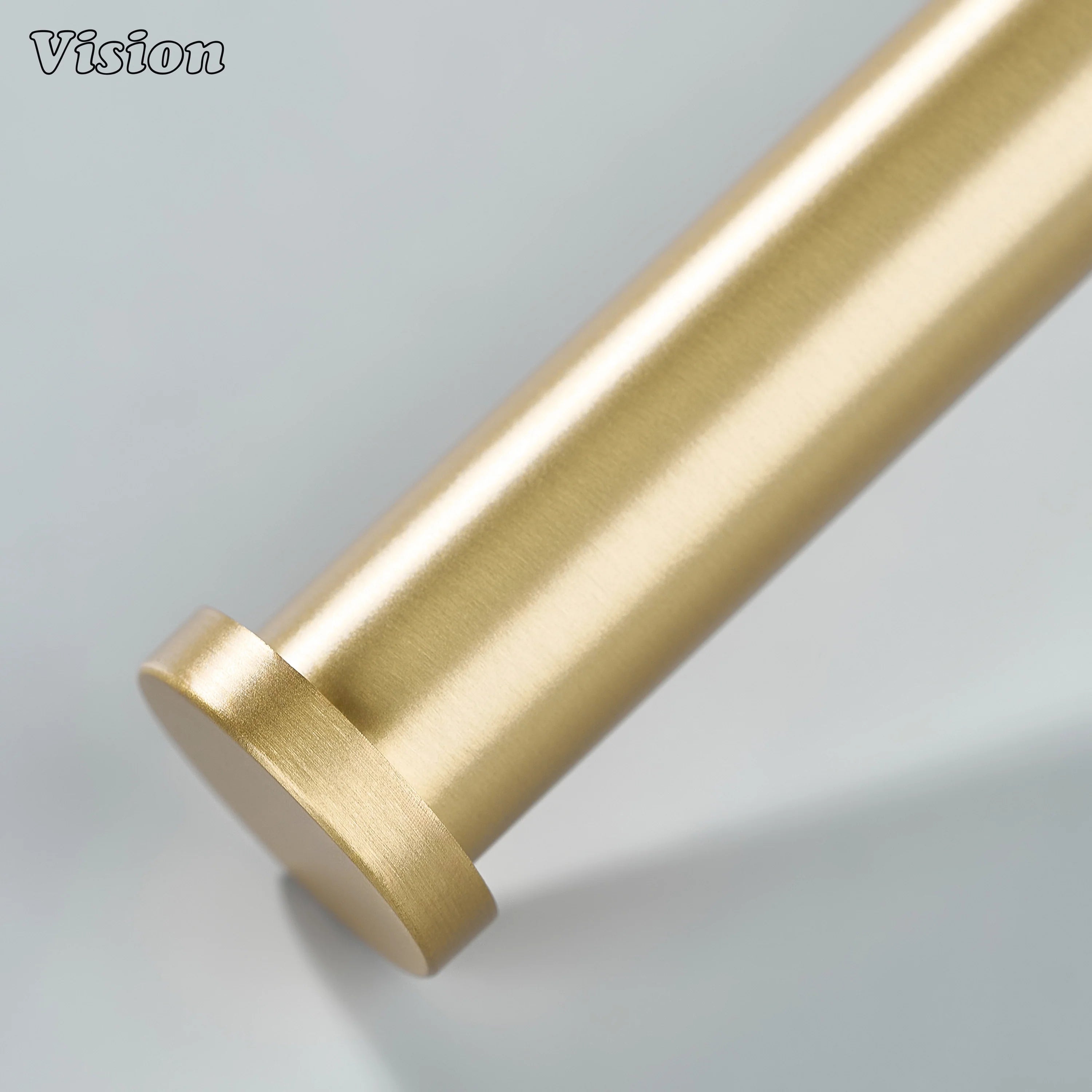 Gold brass towel holder showcasing knurled bar profile and round base for towel hanging