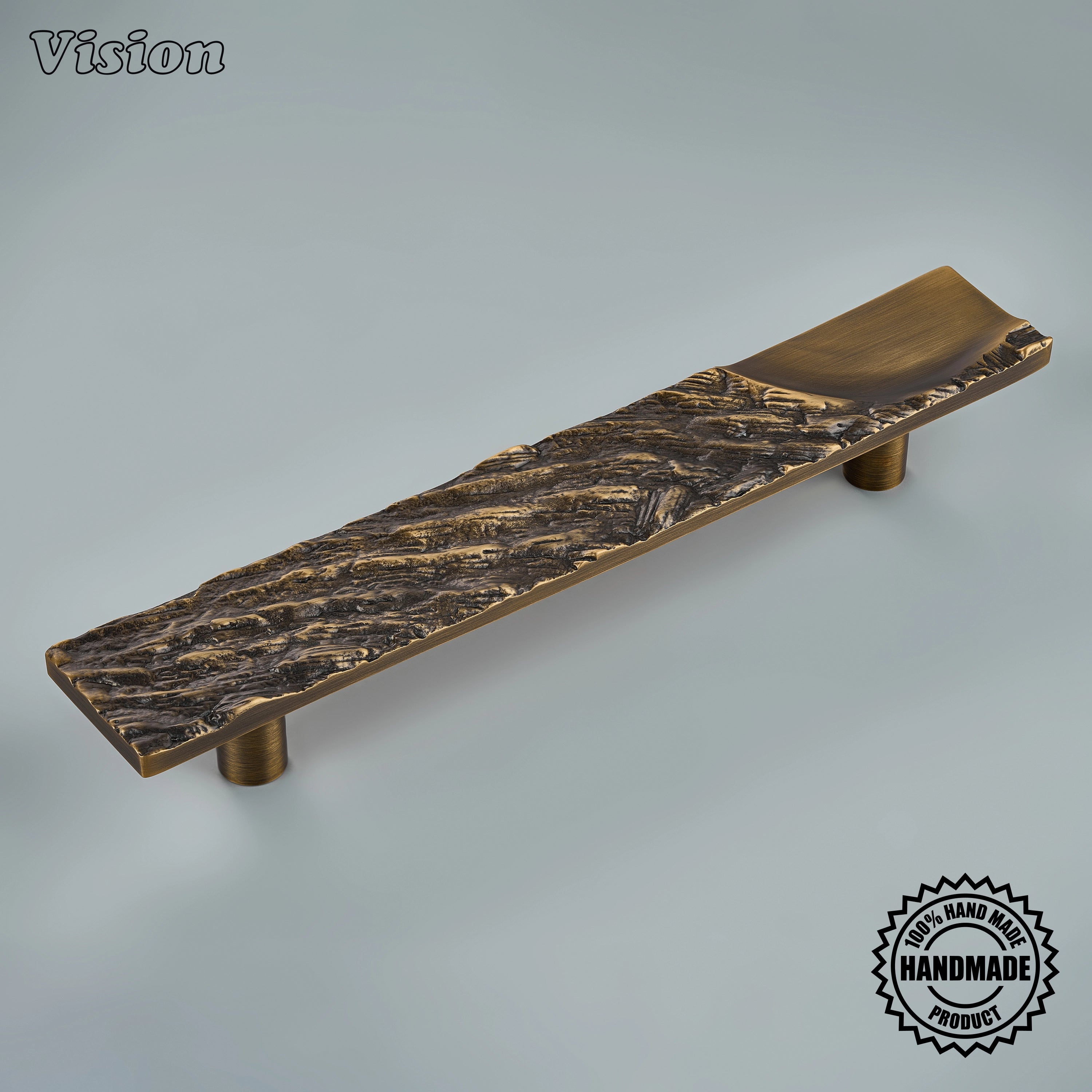 Antique Bronze handcrafted appliance pull with sculpted bark texture on tall custom pantry doors