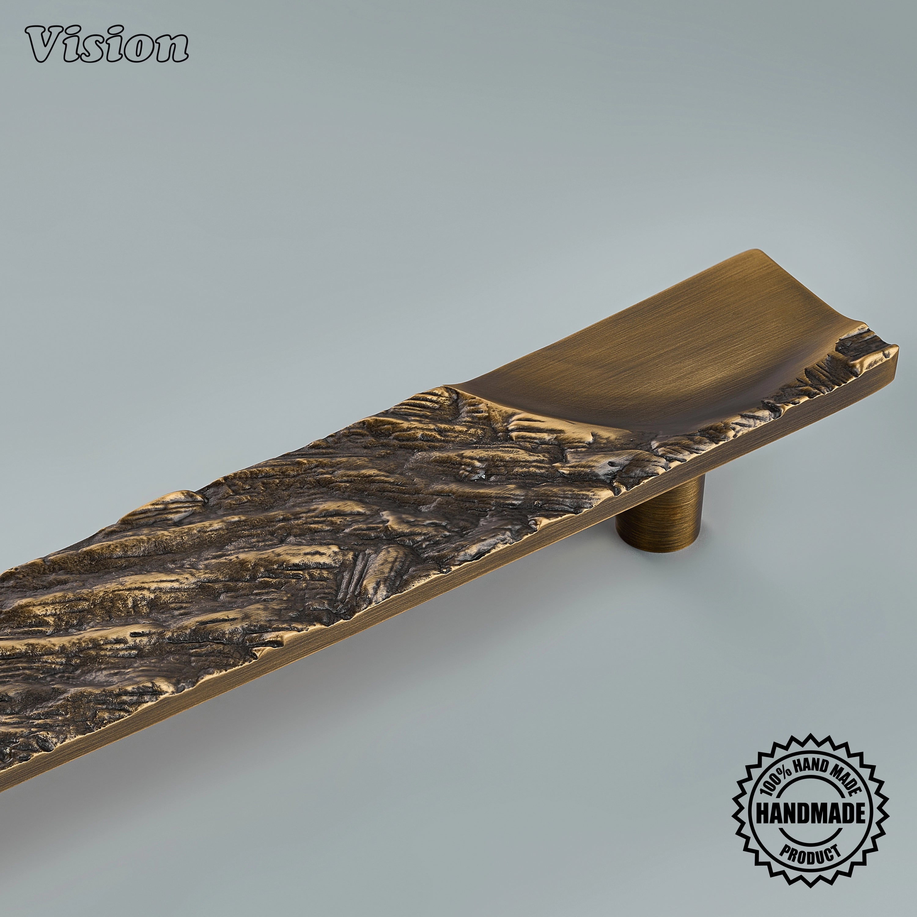 Handcrafted antique bronze appliance pull with organic timber relief on oversized entryway doors