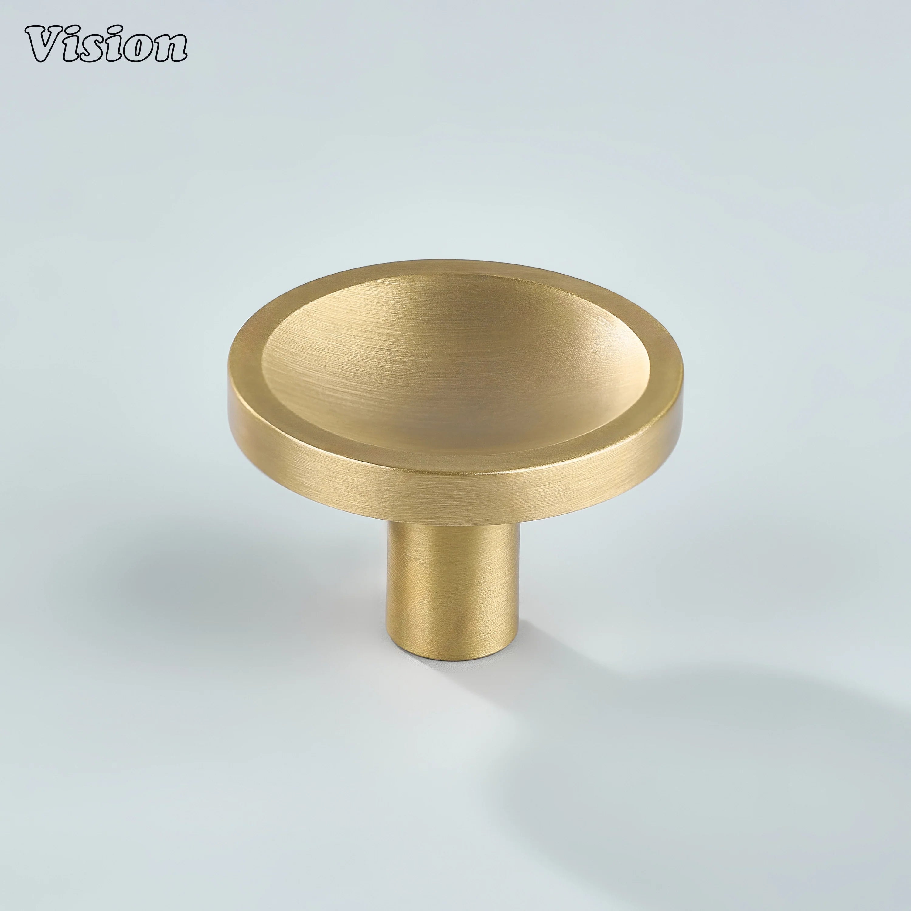 Gold round cabinet knob with concave top design for luxury kitchen cabinetry