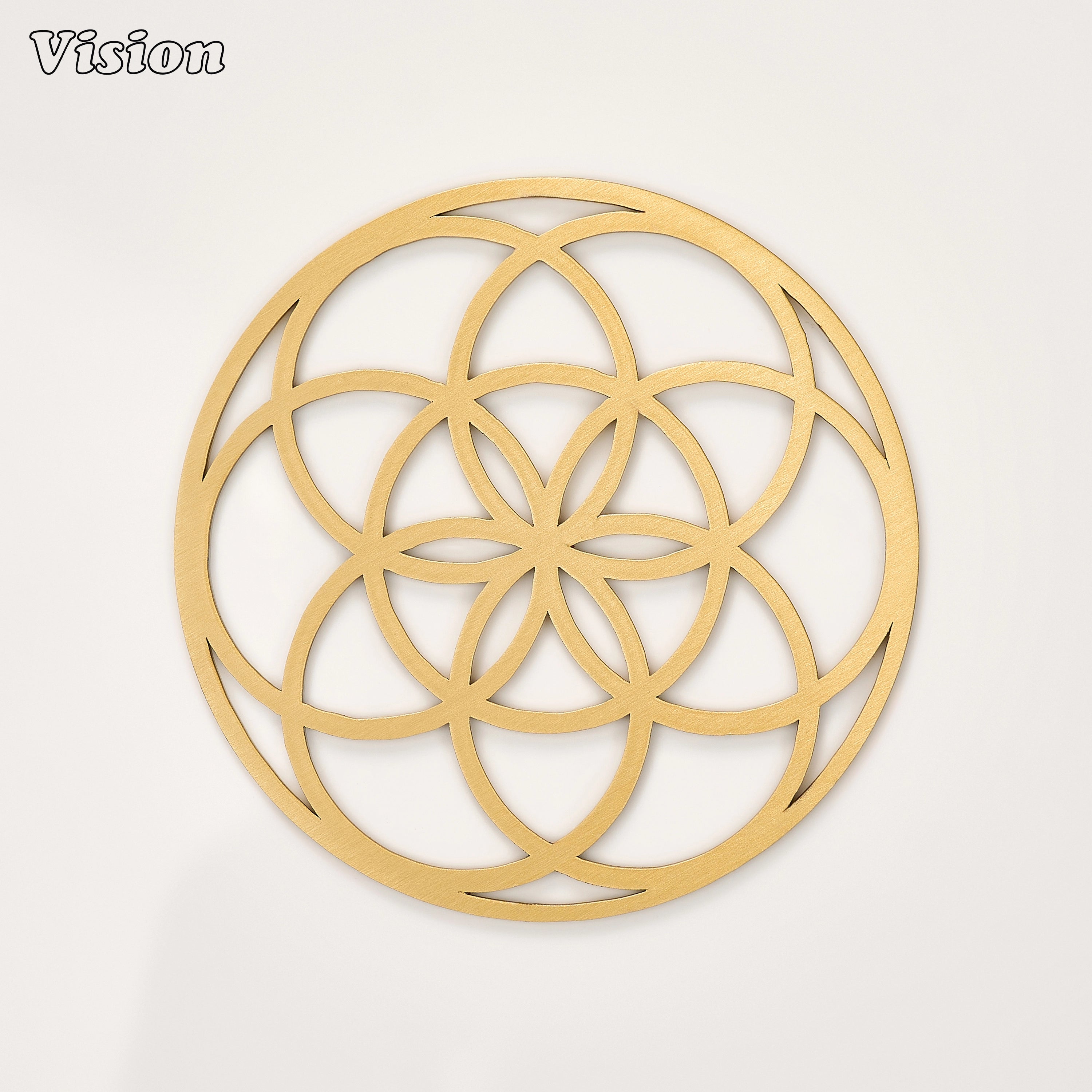 Gold solid brass round coaster featuring a continuous overlapping circular pattern on a luxury wooden bar cart