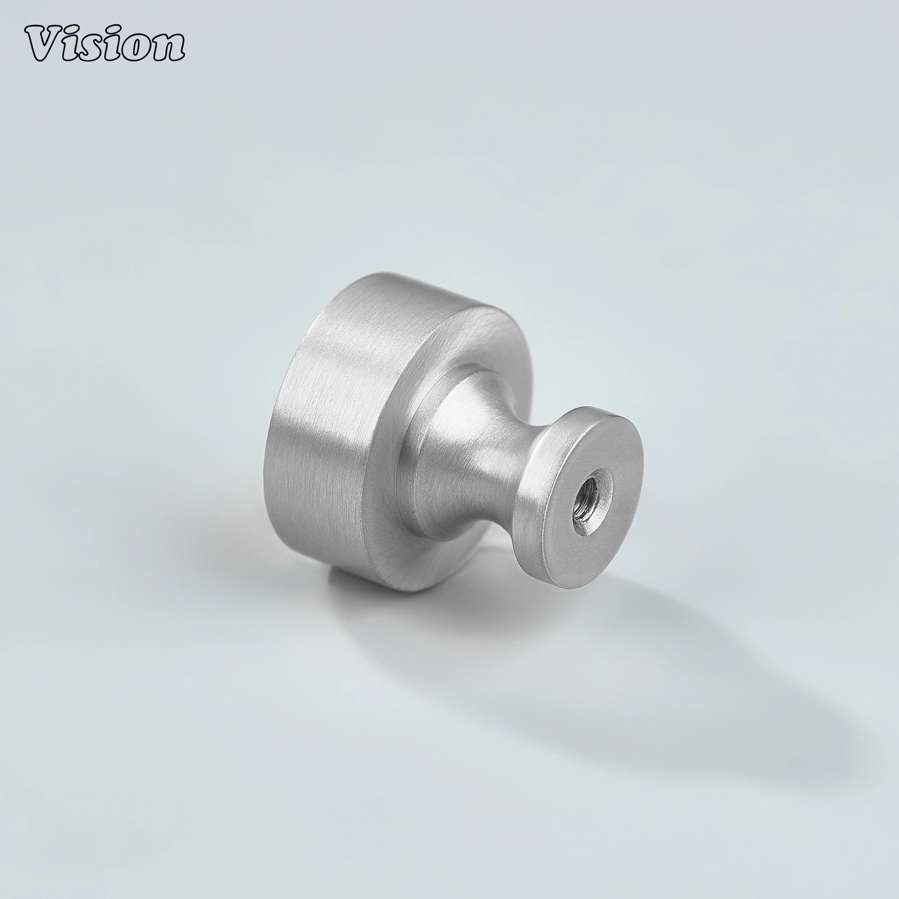 Small round Silver cabinet knob installed on wardrobe panels