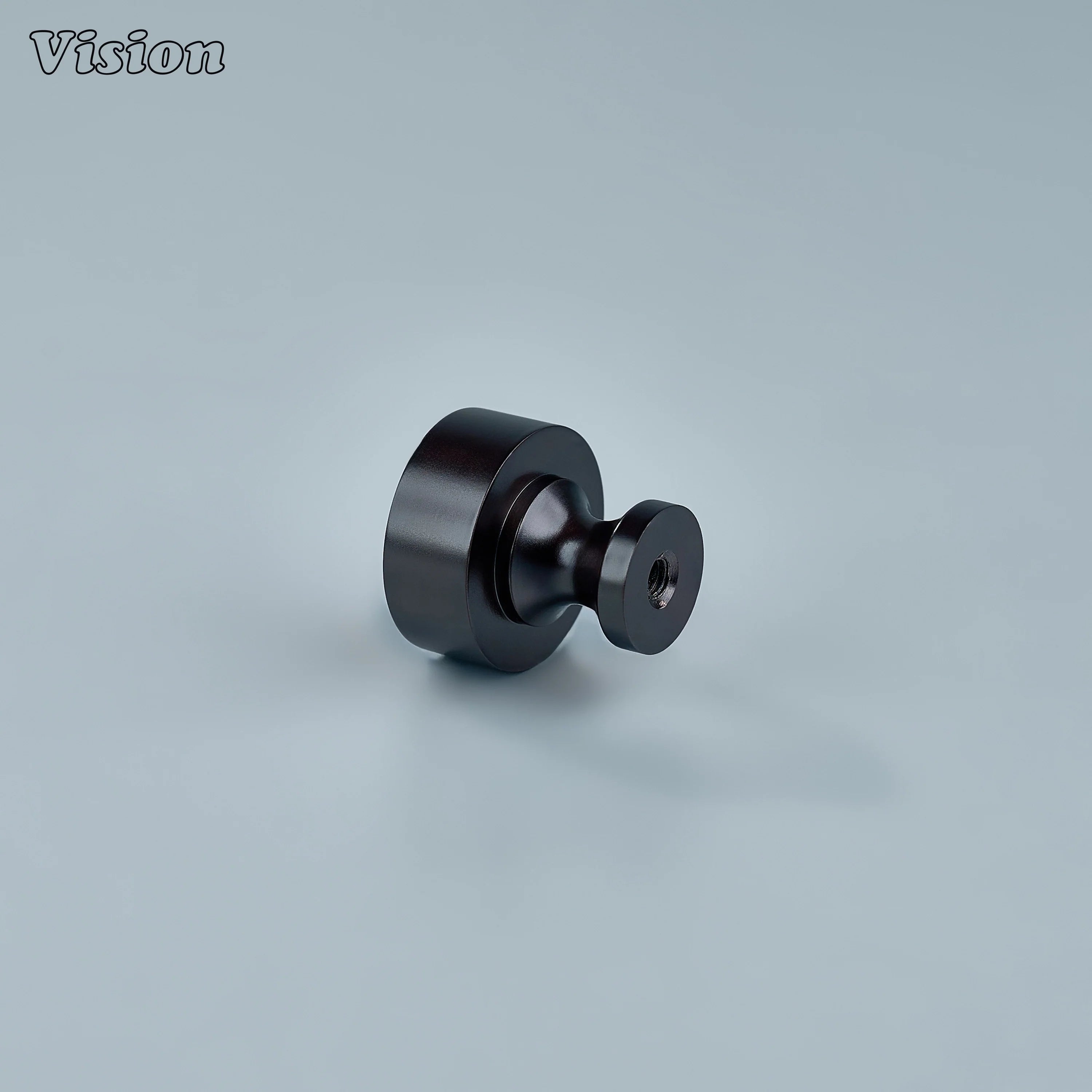Small round Oil Rubbed Bronze cabinet knob used on wardrobe doors