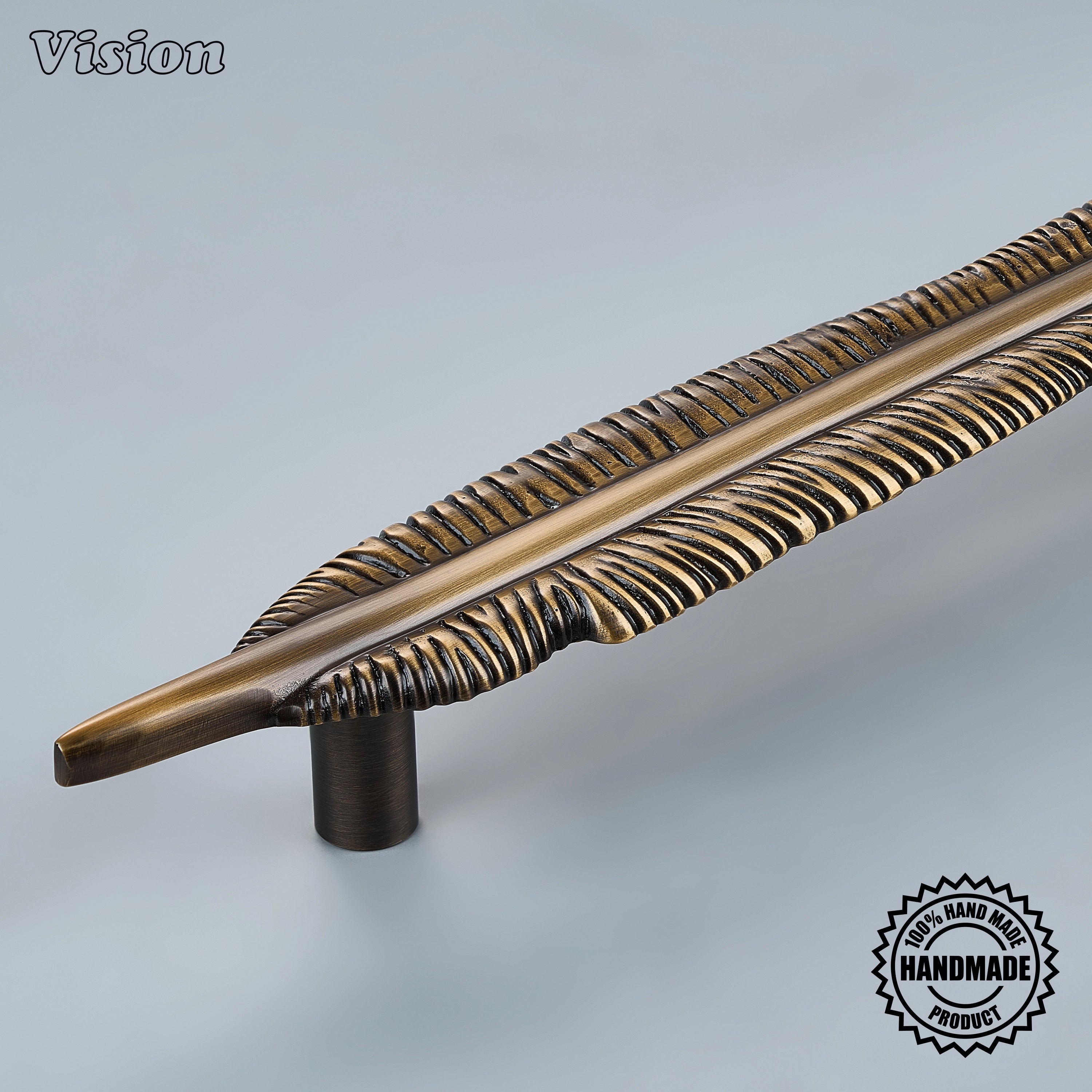 Premium solid brass cabinet handle in Antique Bronze finish with decorative feather detailing for pantry doors.