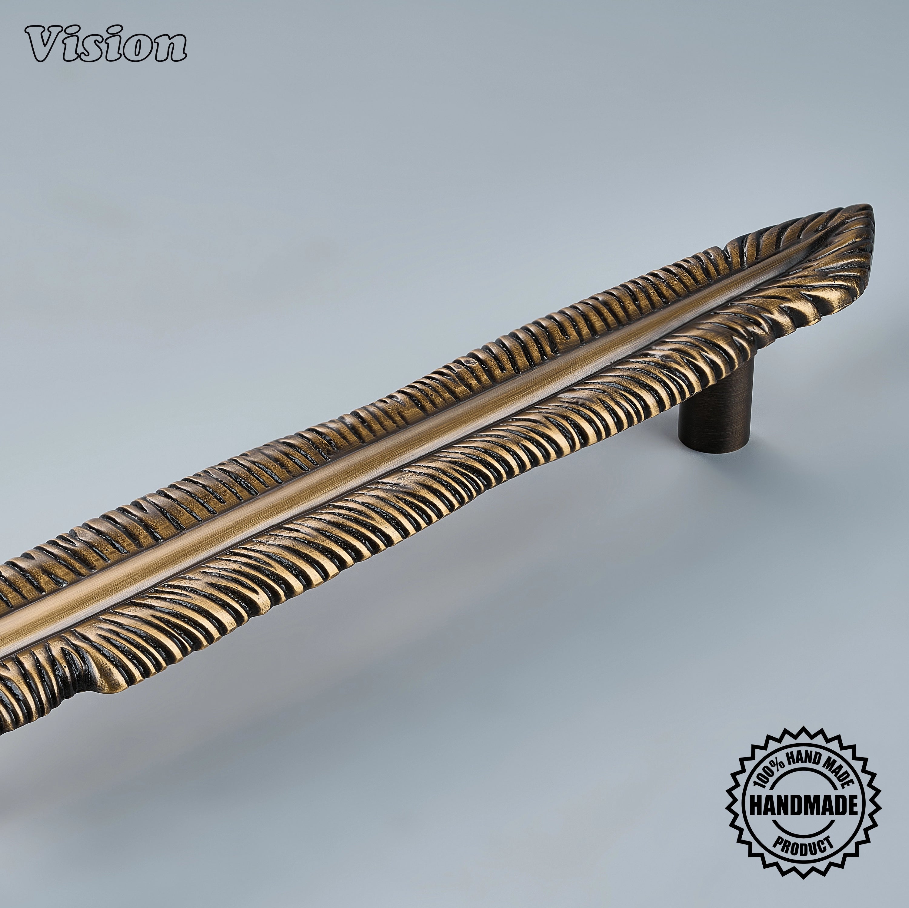 Handcrafted Antique Bronze cabinet pull with sculpted feather texture for premium built-in cabinetry.