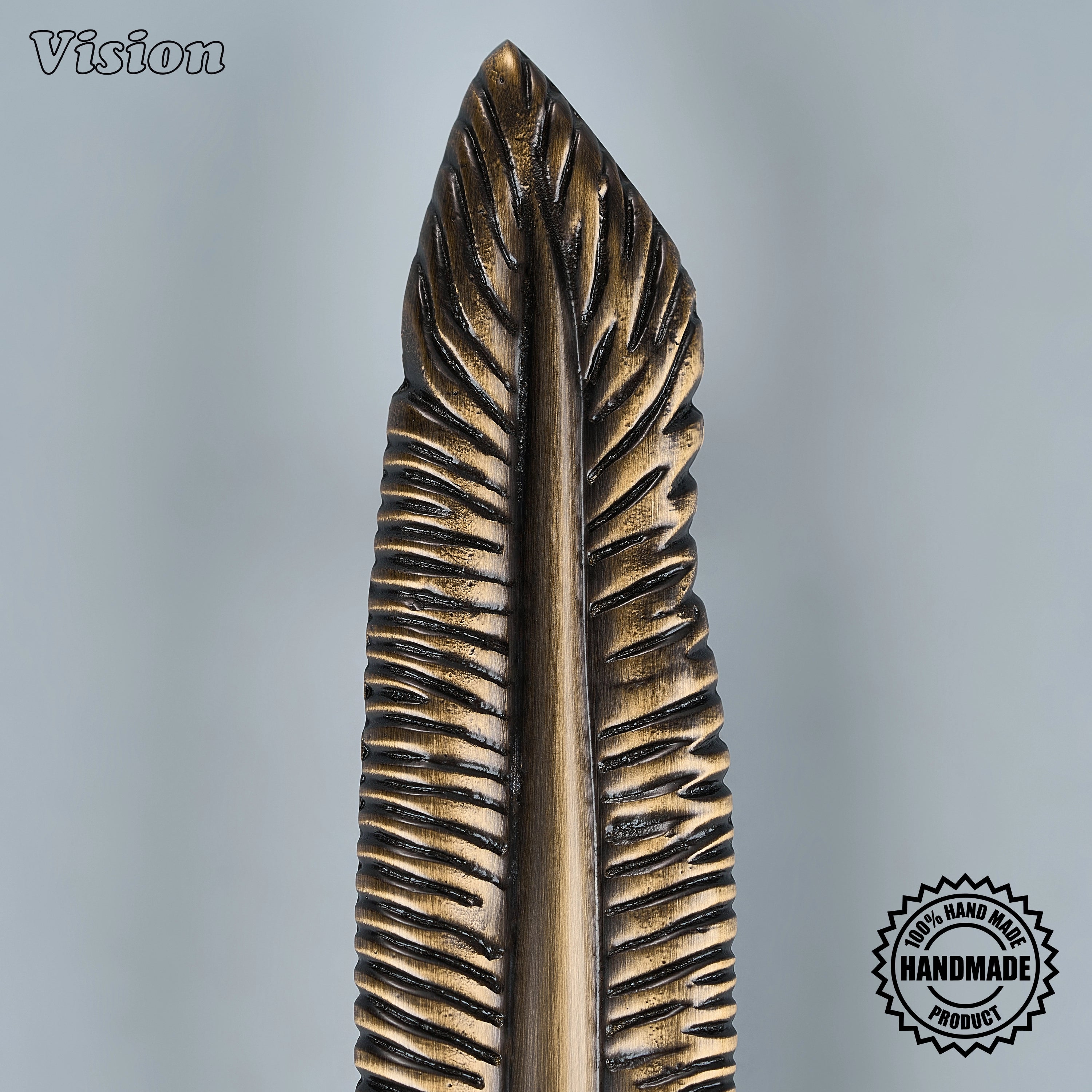 Decorative Antique Bronze cabinet pull with feather-inspired profile for drawers and pantry cabinets.