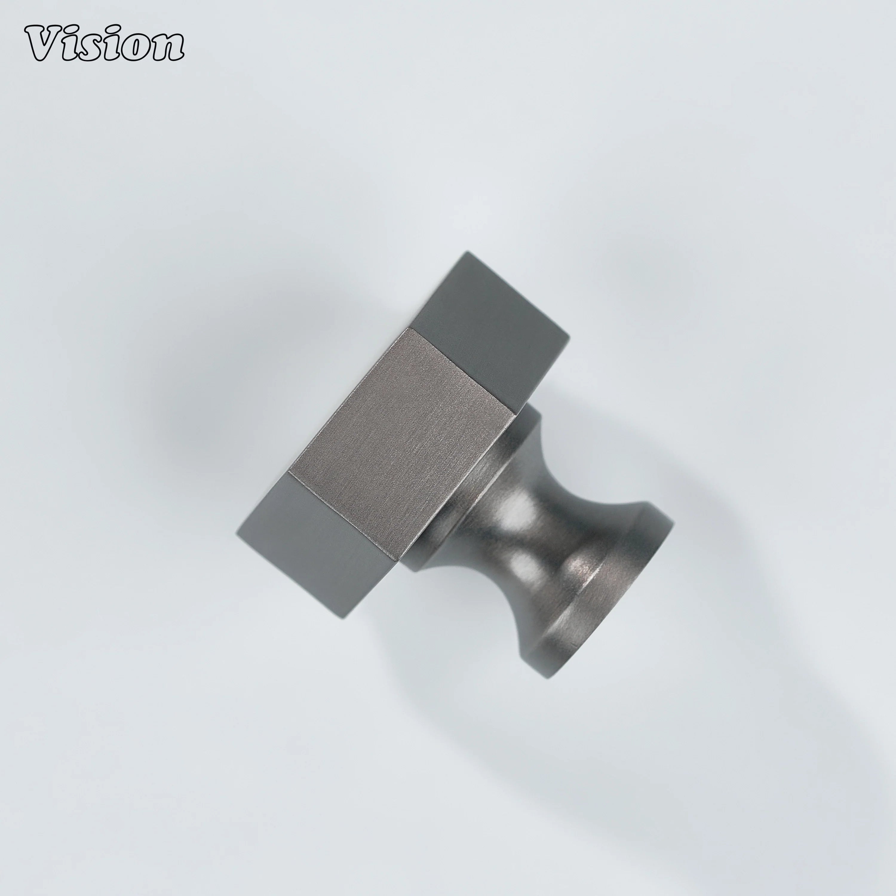 Cabinet knob in Gunmetal finish with bold hexagonal brass form