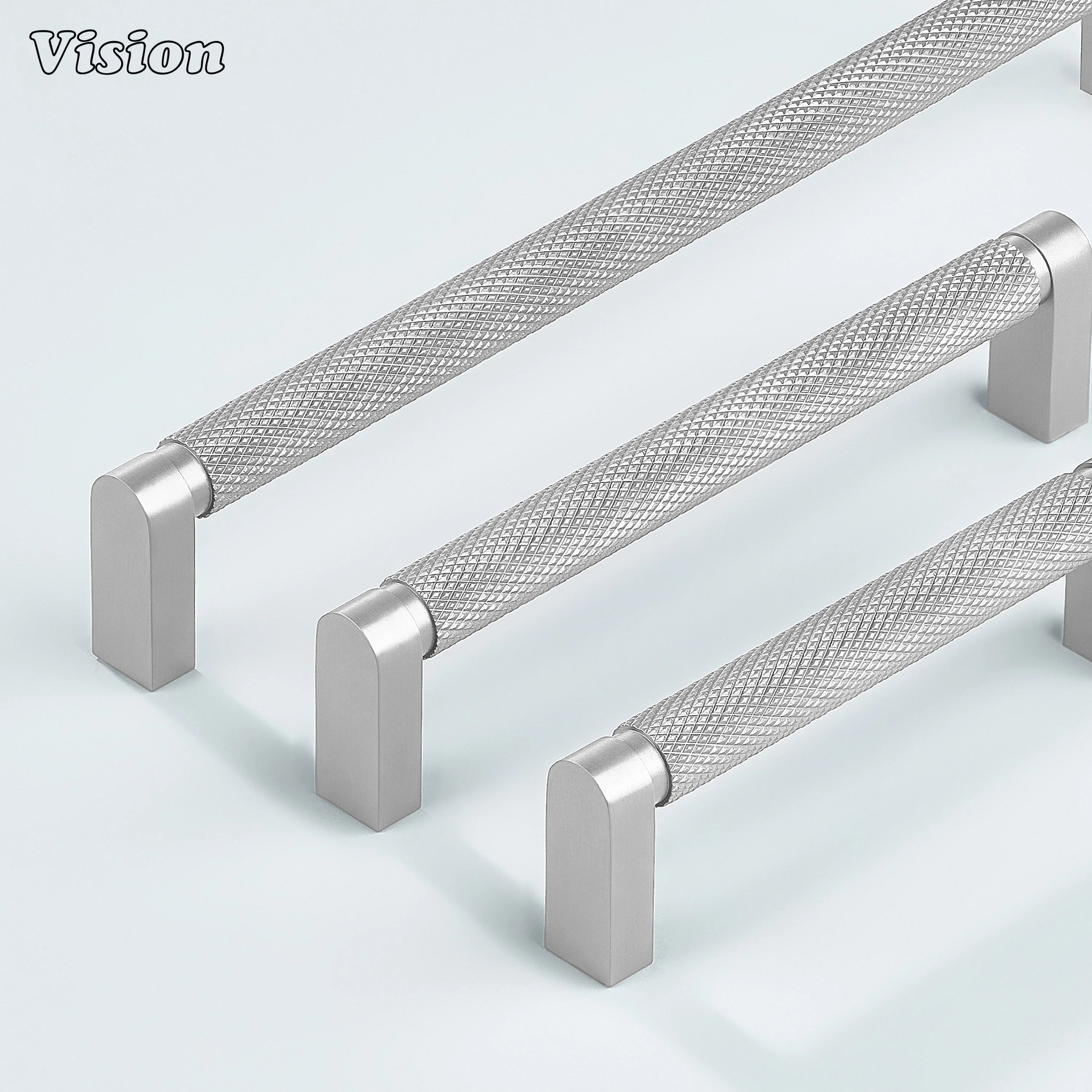 Silver ripple knurled cabinet handle mounted on dresser drawers.