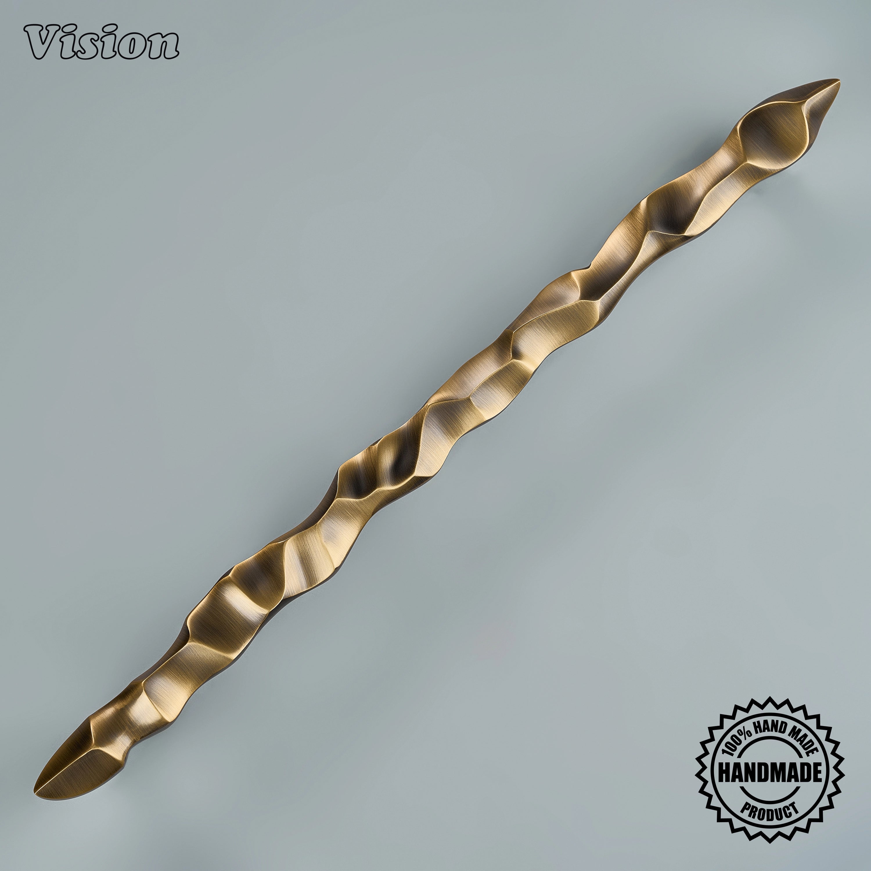 Antique bronze artisanal door handle featuring tactile stream-like relief on interior timber doors