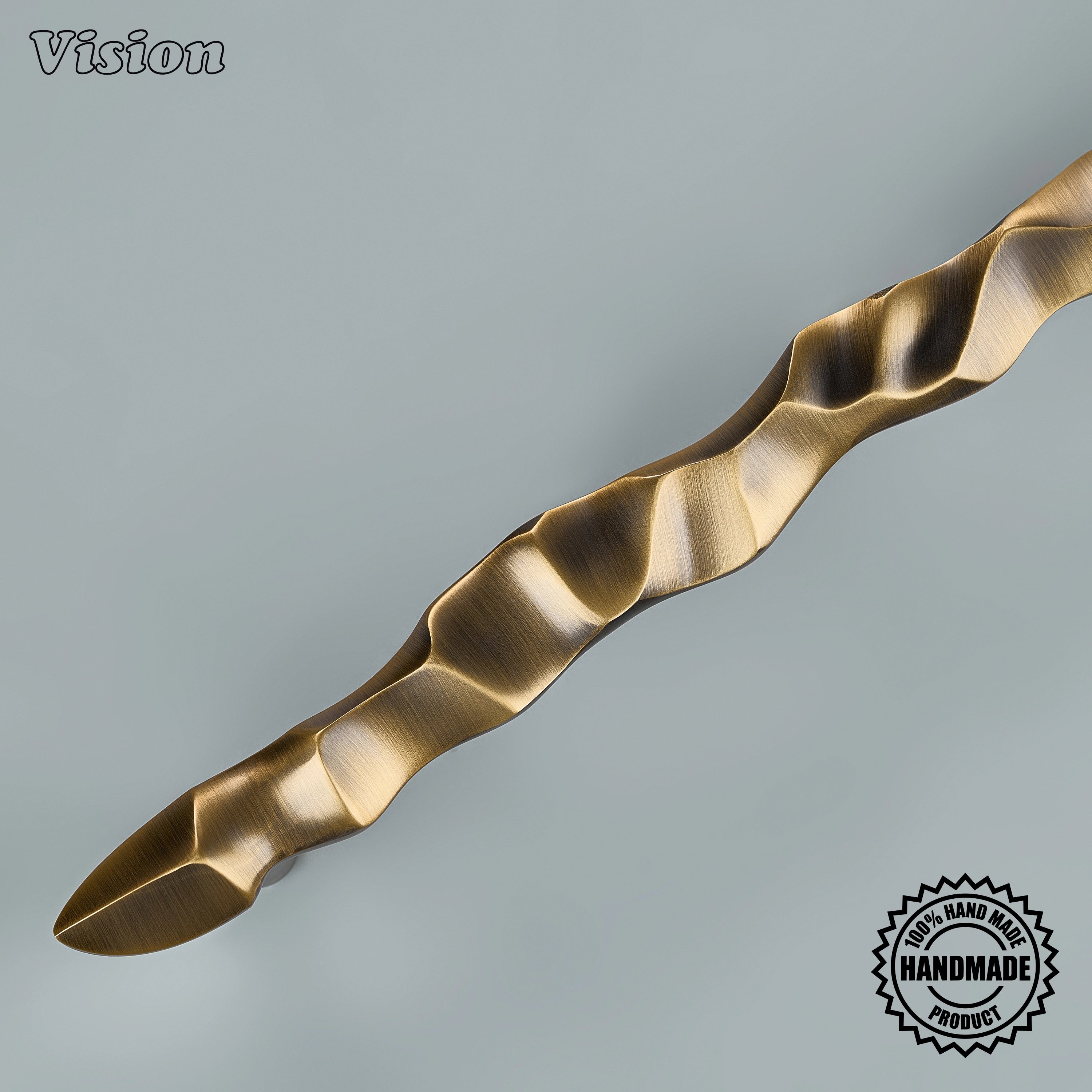 Solid brass antique bronze appliance pull with flowing handcrafted relief on entryway doors