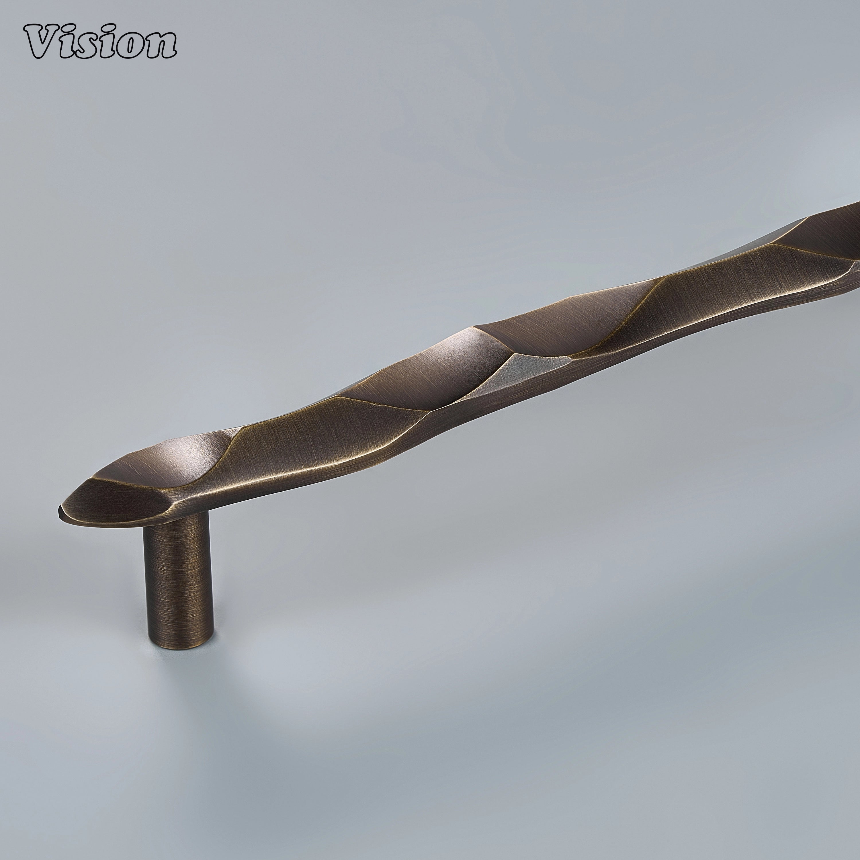 Antique Bronze handcrafted cabinet pull with sculpted undulating texture on modern kitchen cabinets