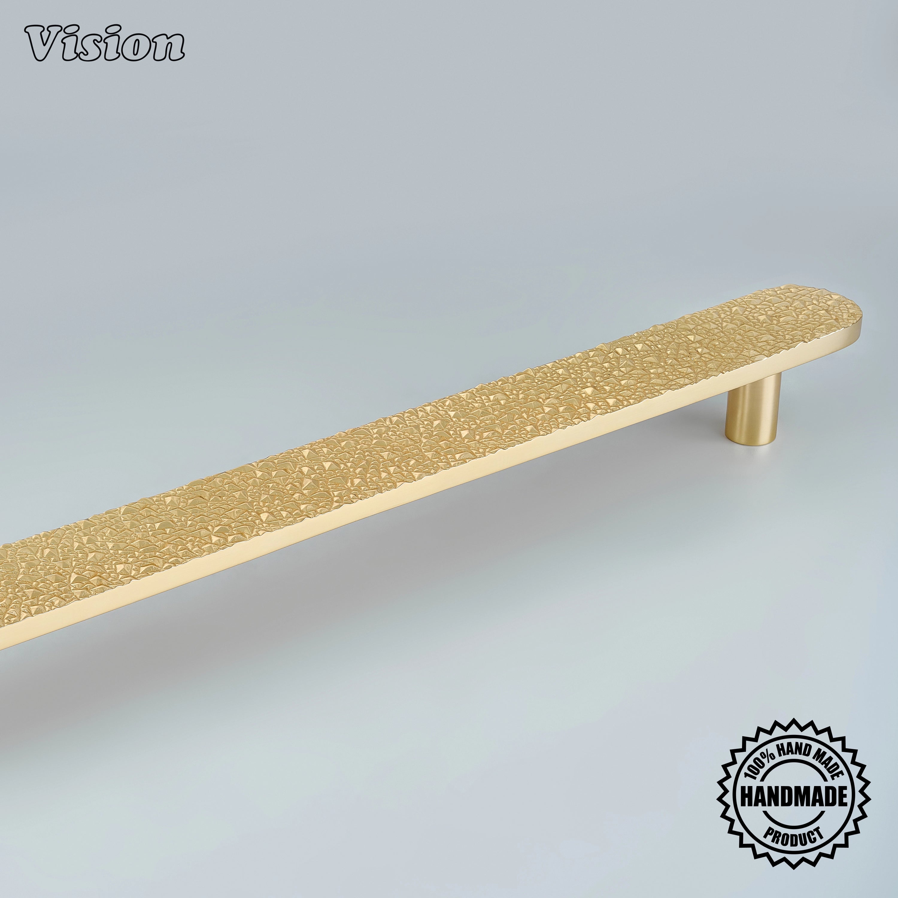 Handcrafted appliance pull in polished brass finish featuring a heavily textured bar for wardrobes