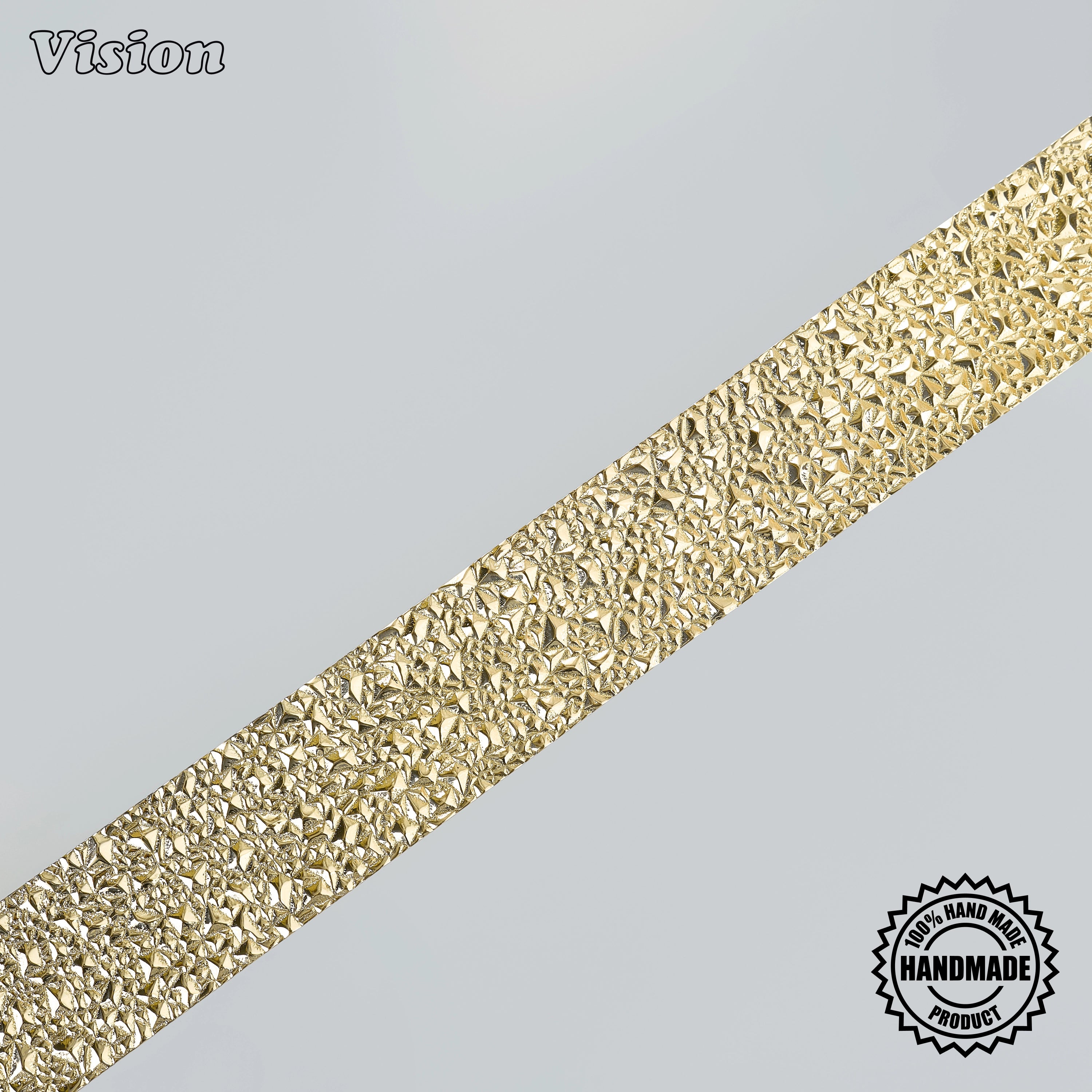 Polished brass appliance pull featuring a handcrafted tactile chiseled surface for statement armoires