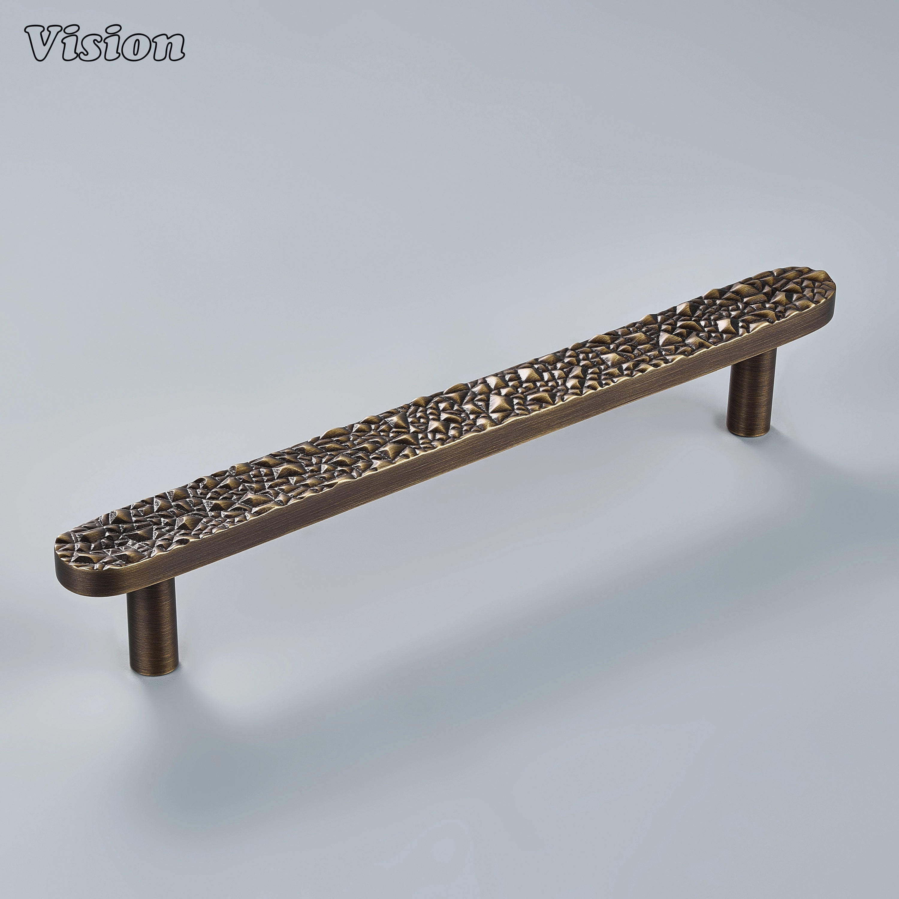 Sculpted antique bronze cabinet handle with crushed stone relief on custom statement drawers