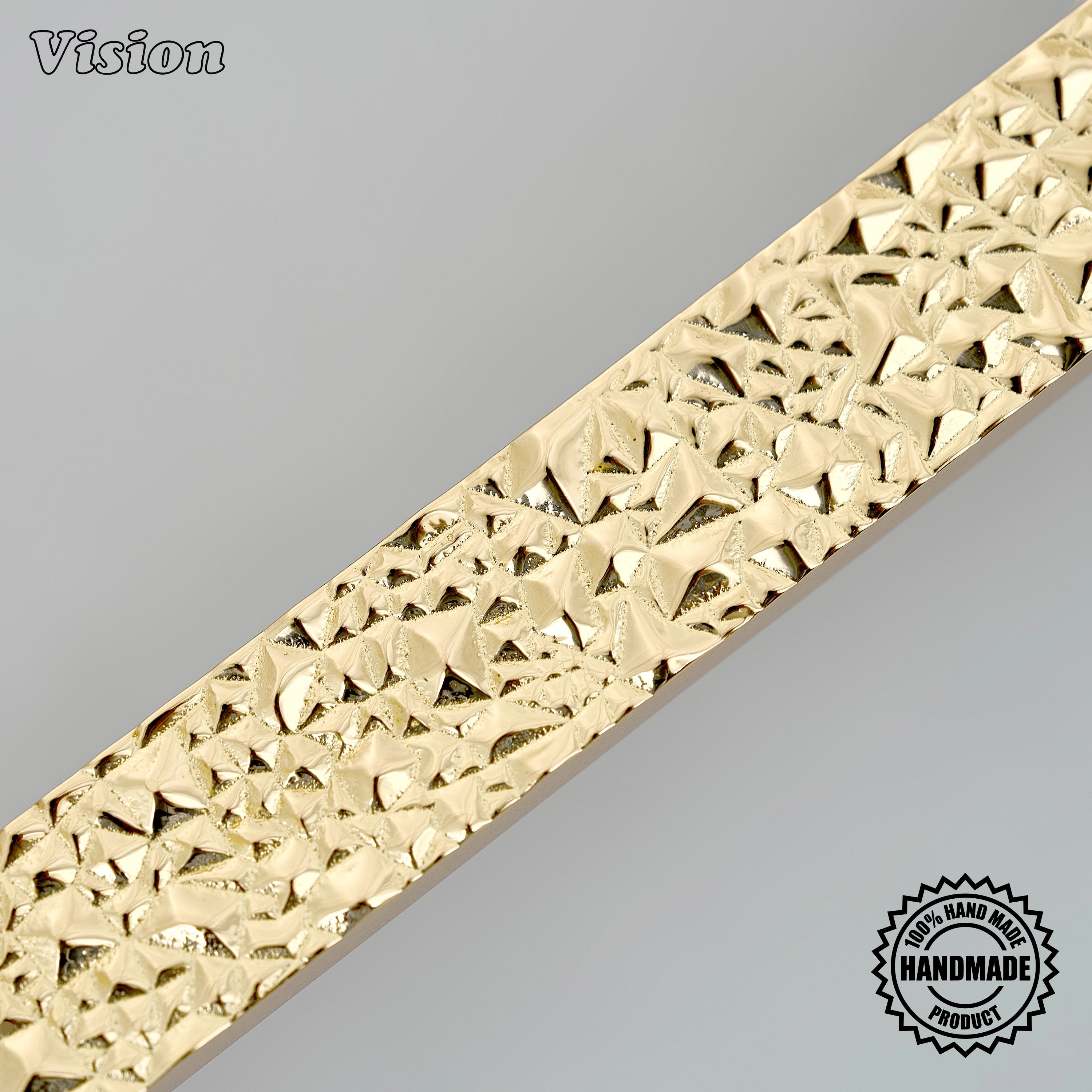 Solid brass polished brass sculpted cabinet pull with heavily textured bar for luxury armoires