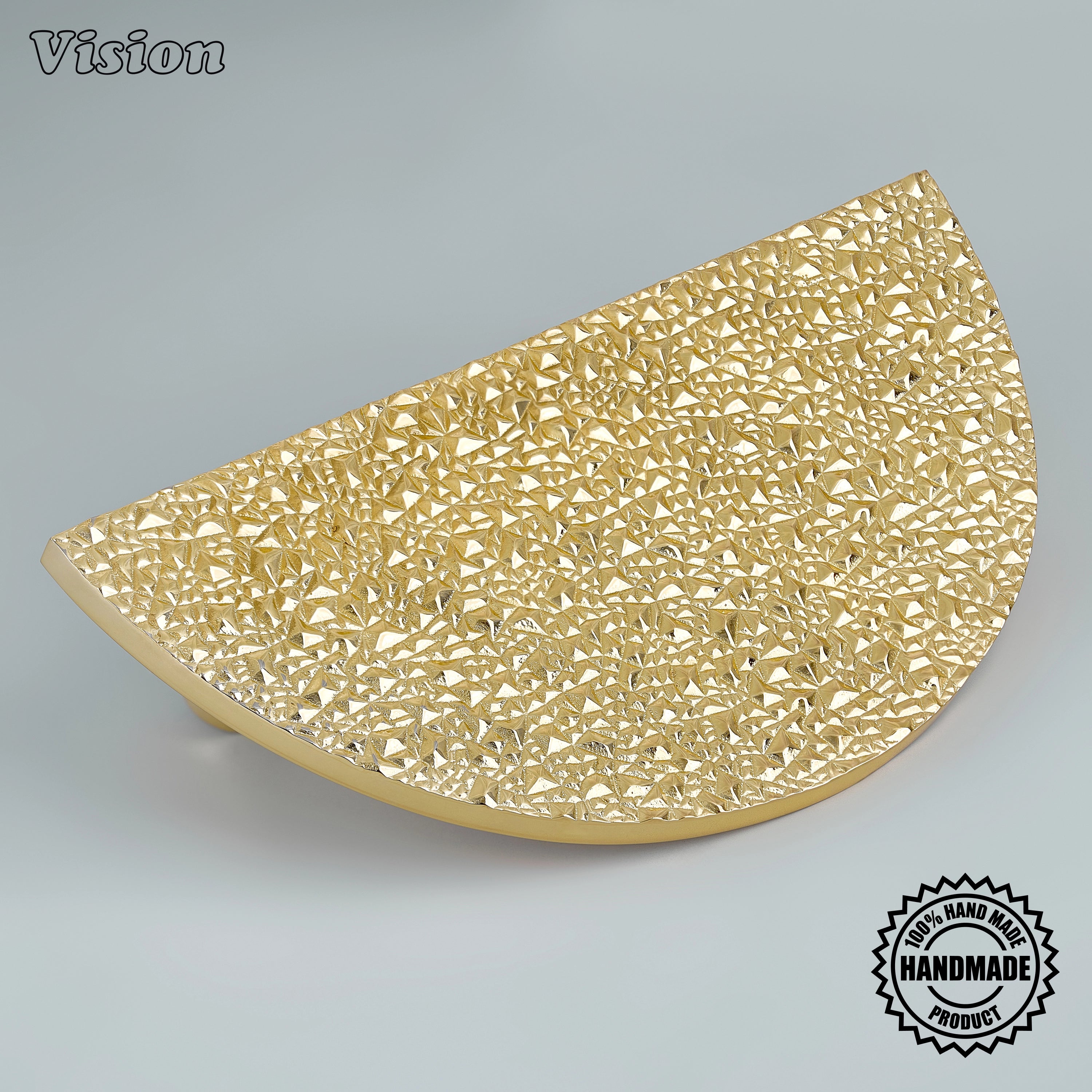 Polished Brass handcrafted half moon door handle with chiseled rock texture on grand double doors