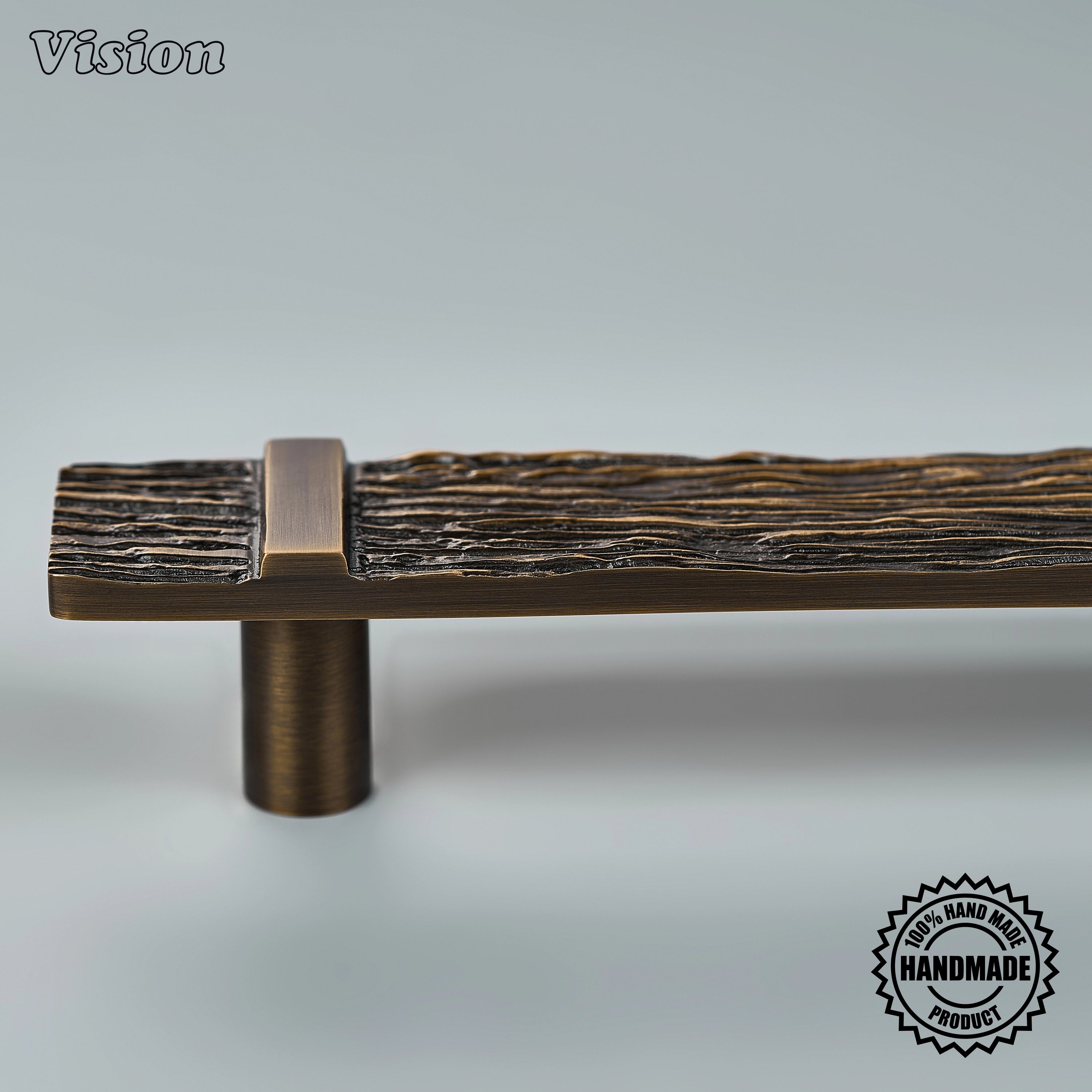 Handcrafted appliance pull in antique bronze finish featuring a deeply textured bar for wardrobes