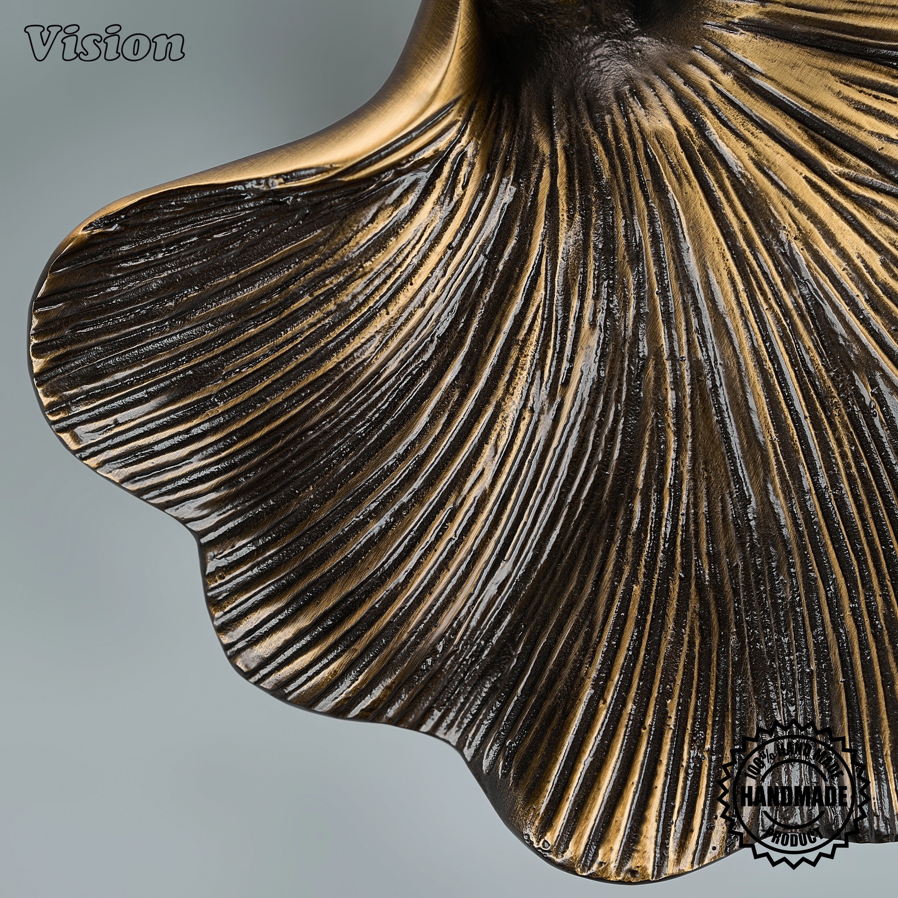 Antique bronze door handle featuring a tactile wavy surface for heavy statement armoires