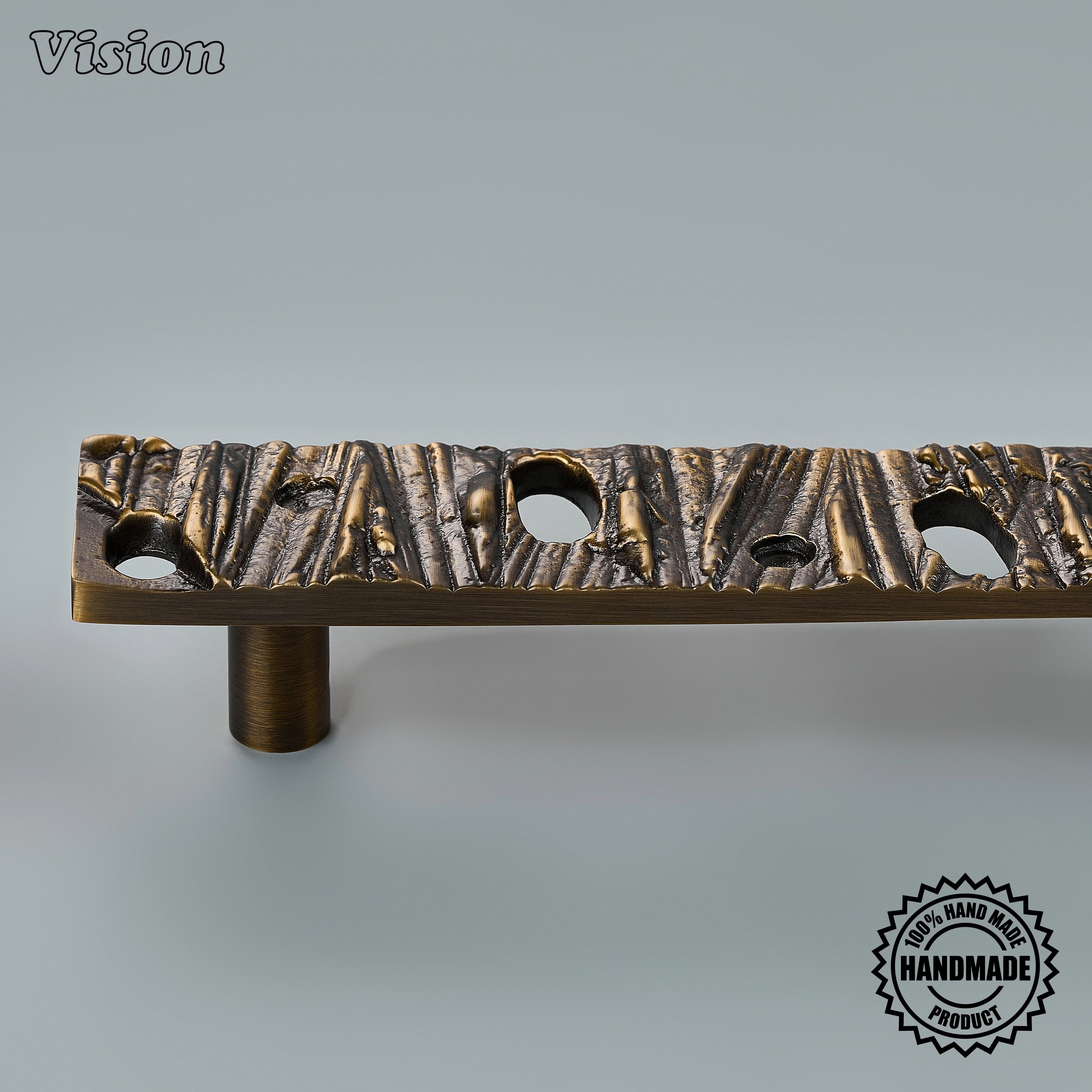 Handcrafted door handle in antique bronze finish with round legs on large closet doors