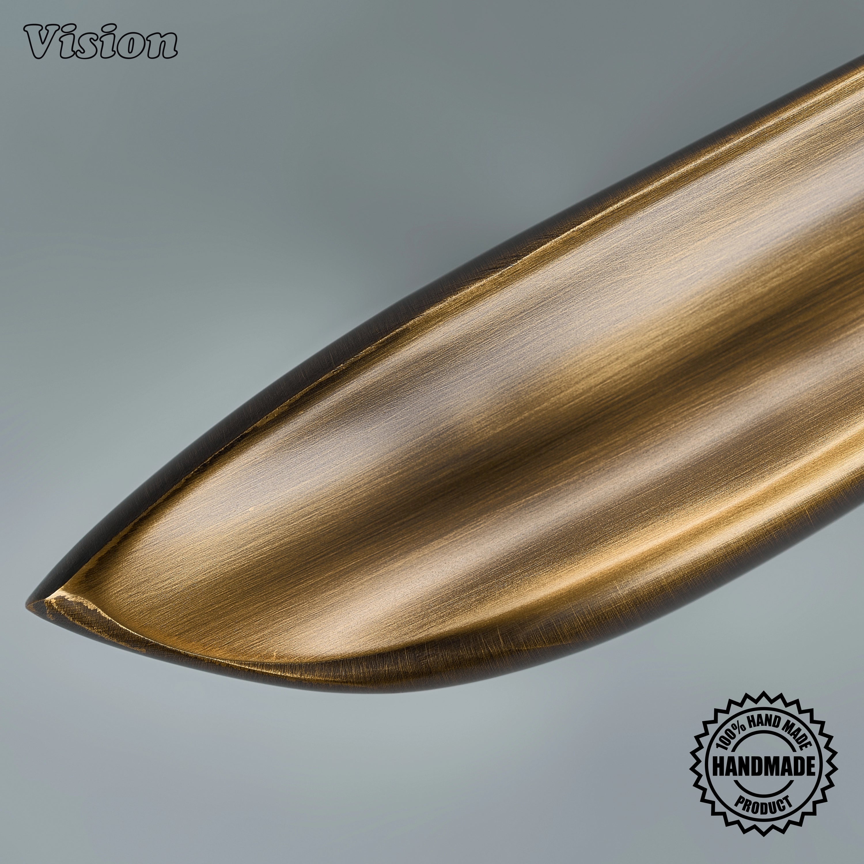 Textured antique bronze sculpted pull handle with botanical details on custom paneled appliances