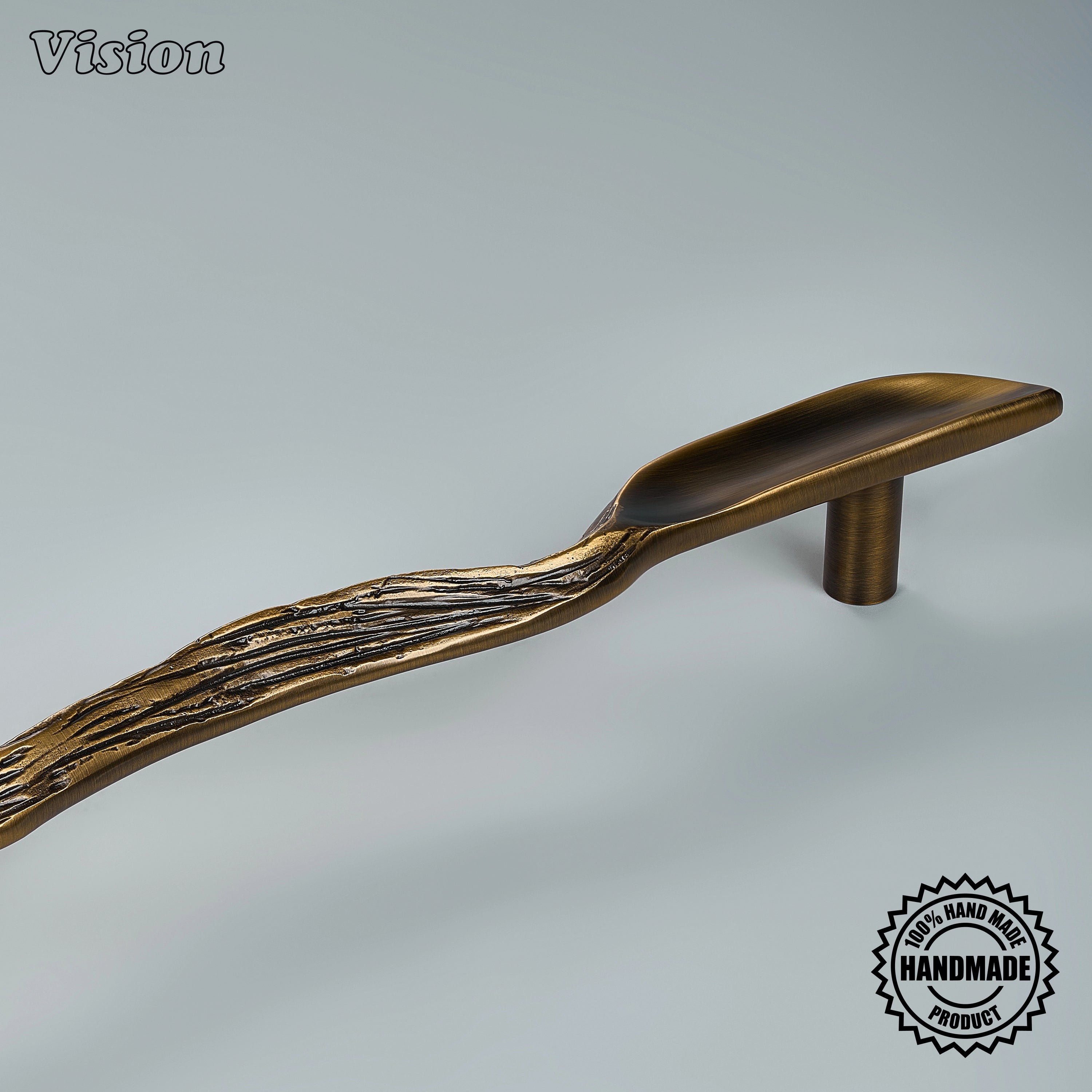 Handcrafted antique bronze appliance pull with organic seed pod profile on oversized entry doors