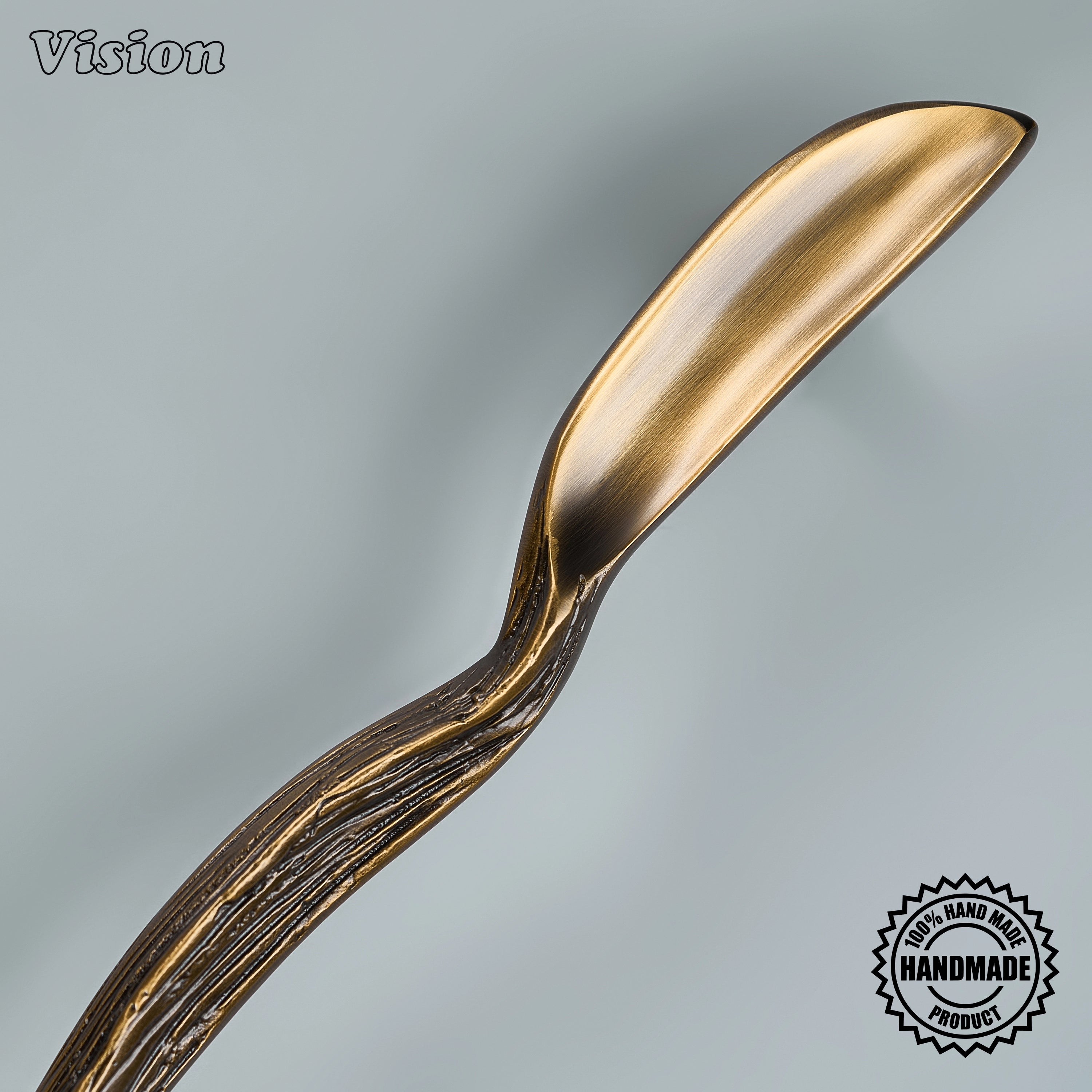 Antique bronze appliance pull featuring a handcrafted tactile core for luxury statement armoires