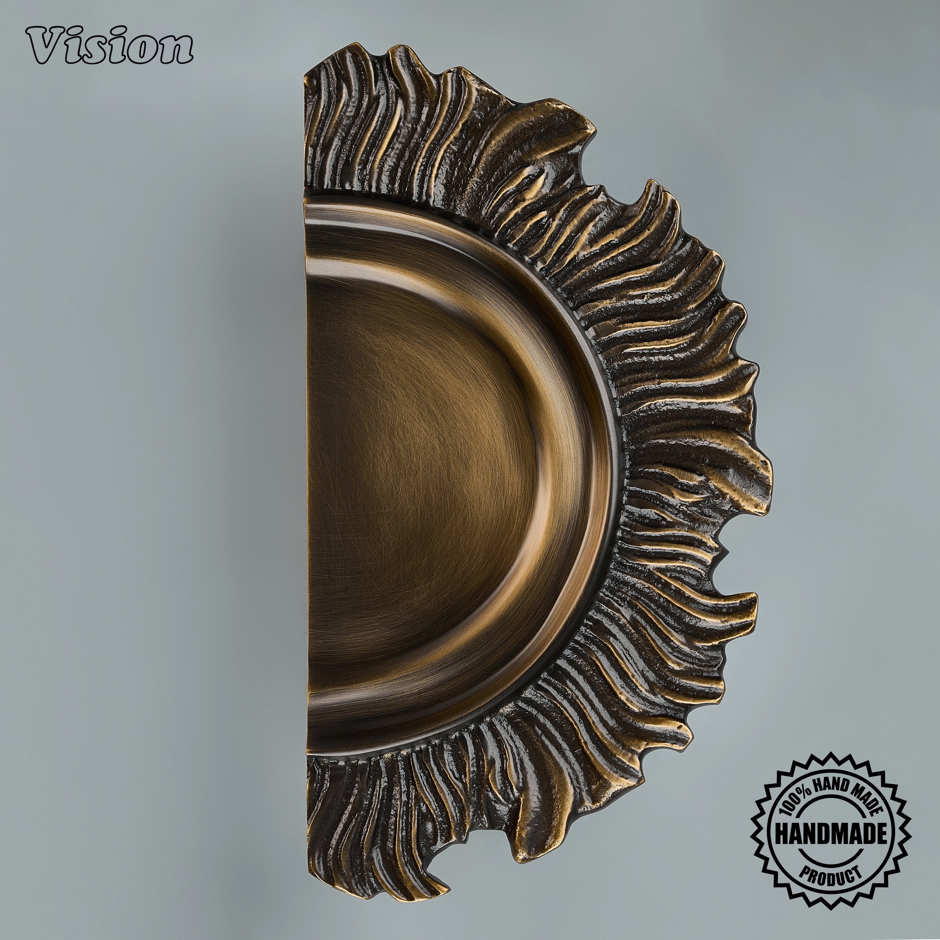 Antique Bronze handcrafted decorative door pull with sculpted rays for premium architectural interiors.
