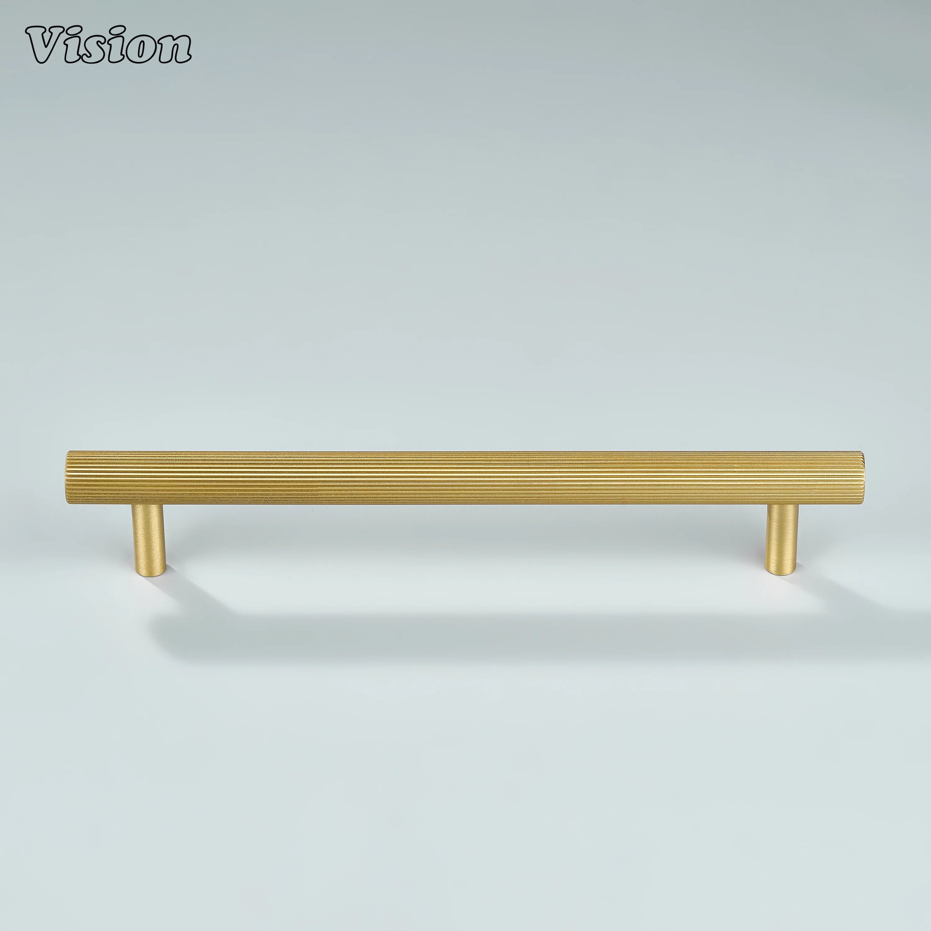 Gold linear knurled cabinet pull installed on bathroom vanity cabinets.