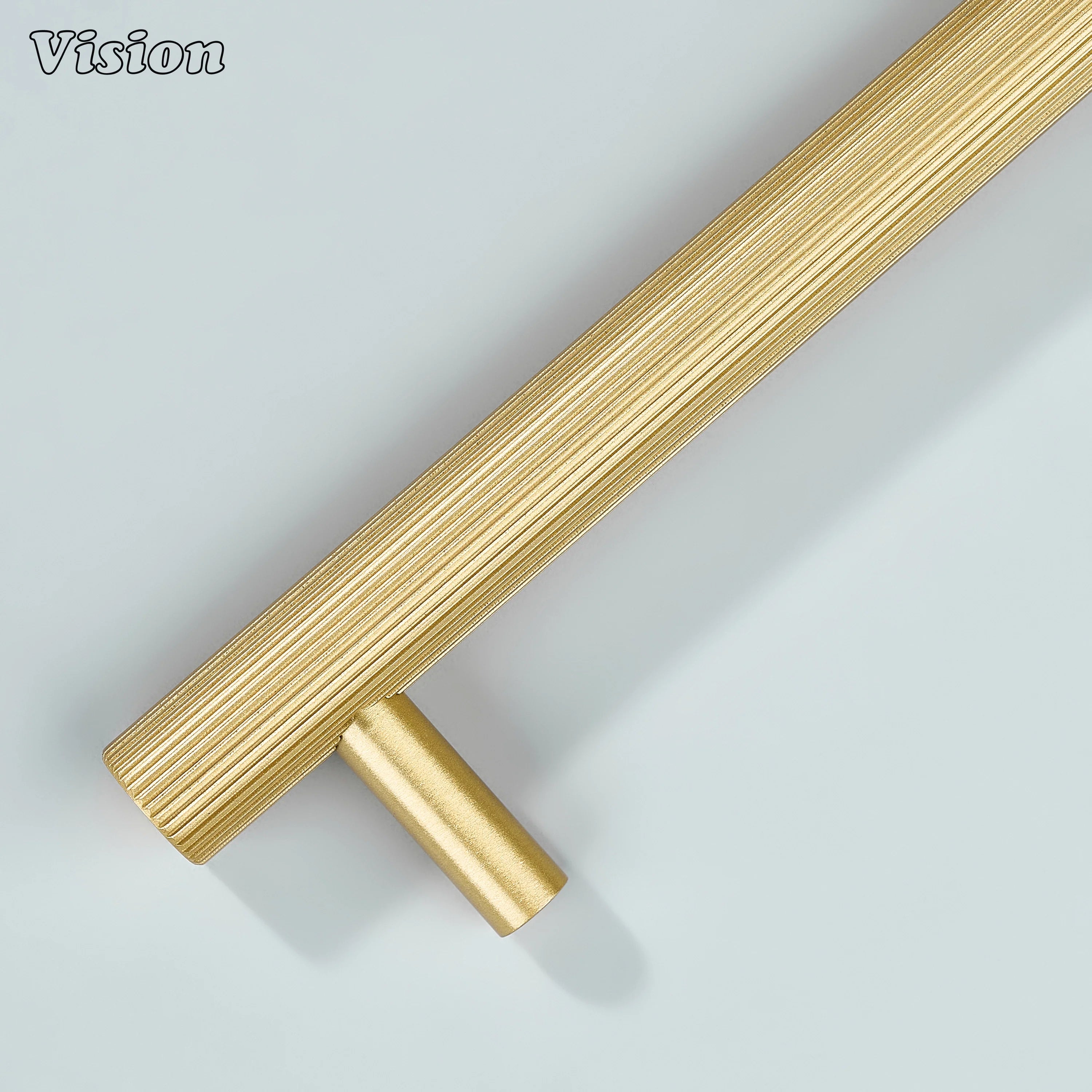 Gold linear knurled handle with sleek legs for wardrobe and closet doors.
