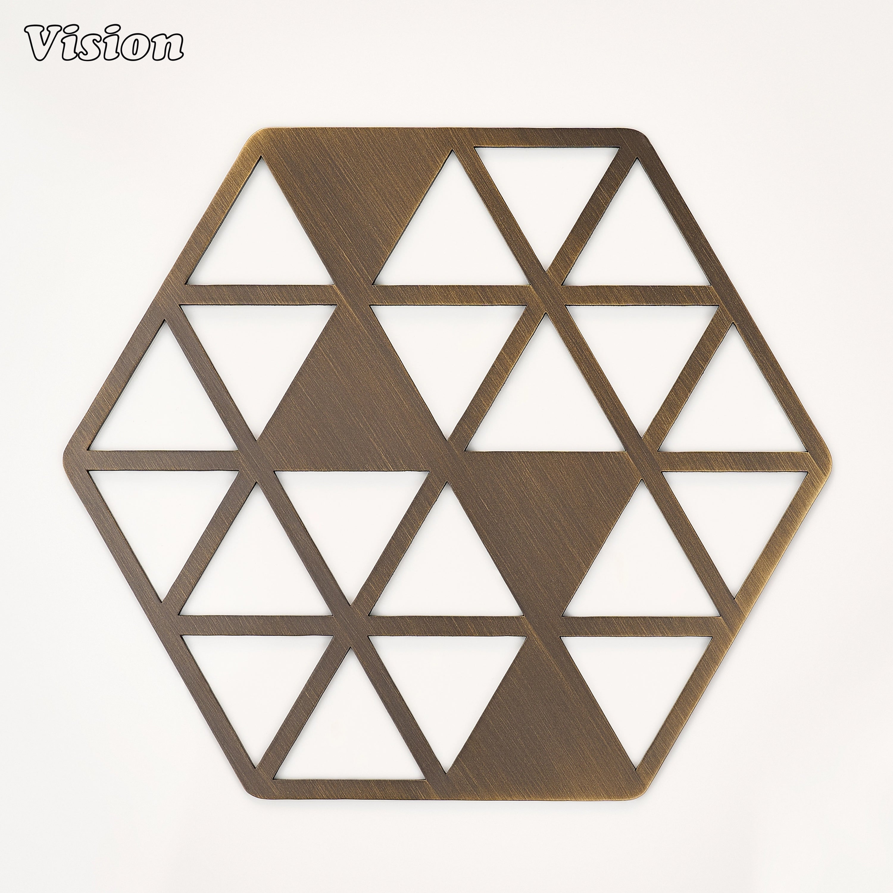 Antique Bronze solid brass hexagon coaster with geometric intersecting triangles on a dining table