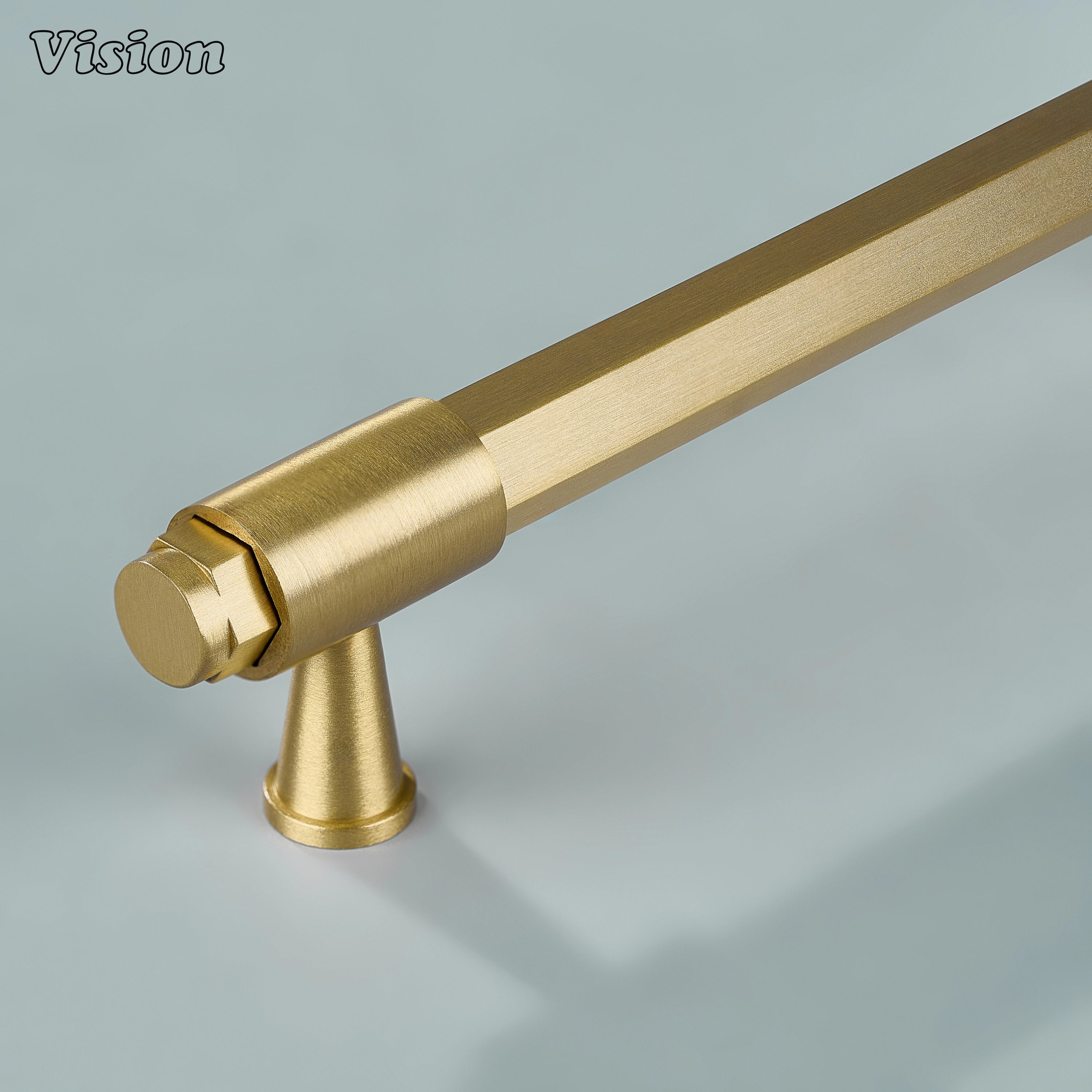 Gold hexagonal brass cabinet handle with circular extruded ends, ring detailed cone legs and geometric profile for kitchen cabinets