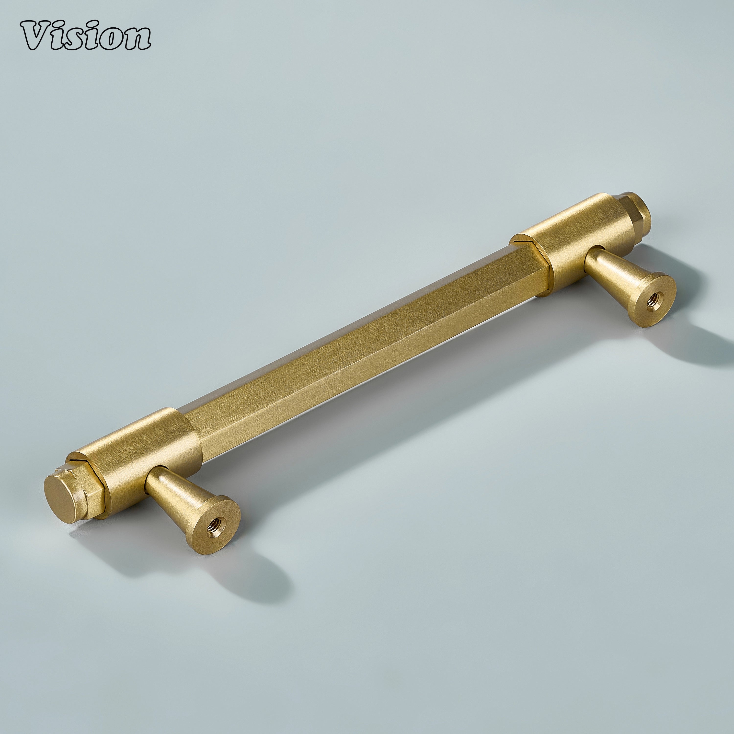 Gold cabinet handle with plain hexagonal profile and cone-shaped feet with ring accents for modern cabinetry