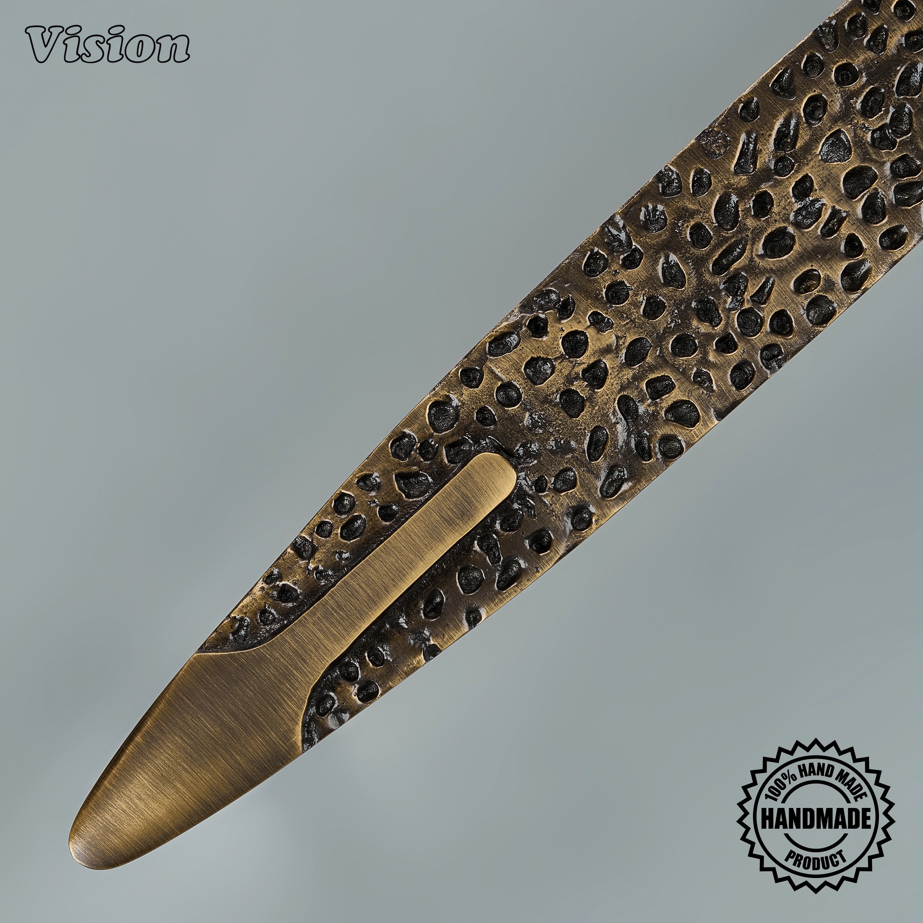Antique Bronze solid brass pull featuring textured center and sleek end grips for luxury cabinet installations.