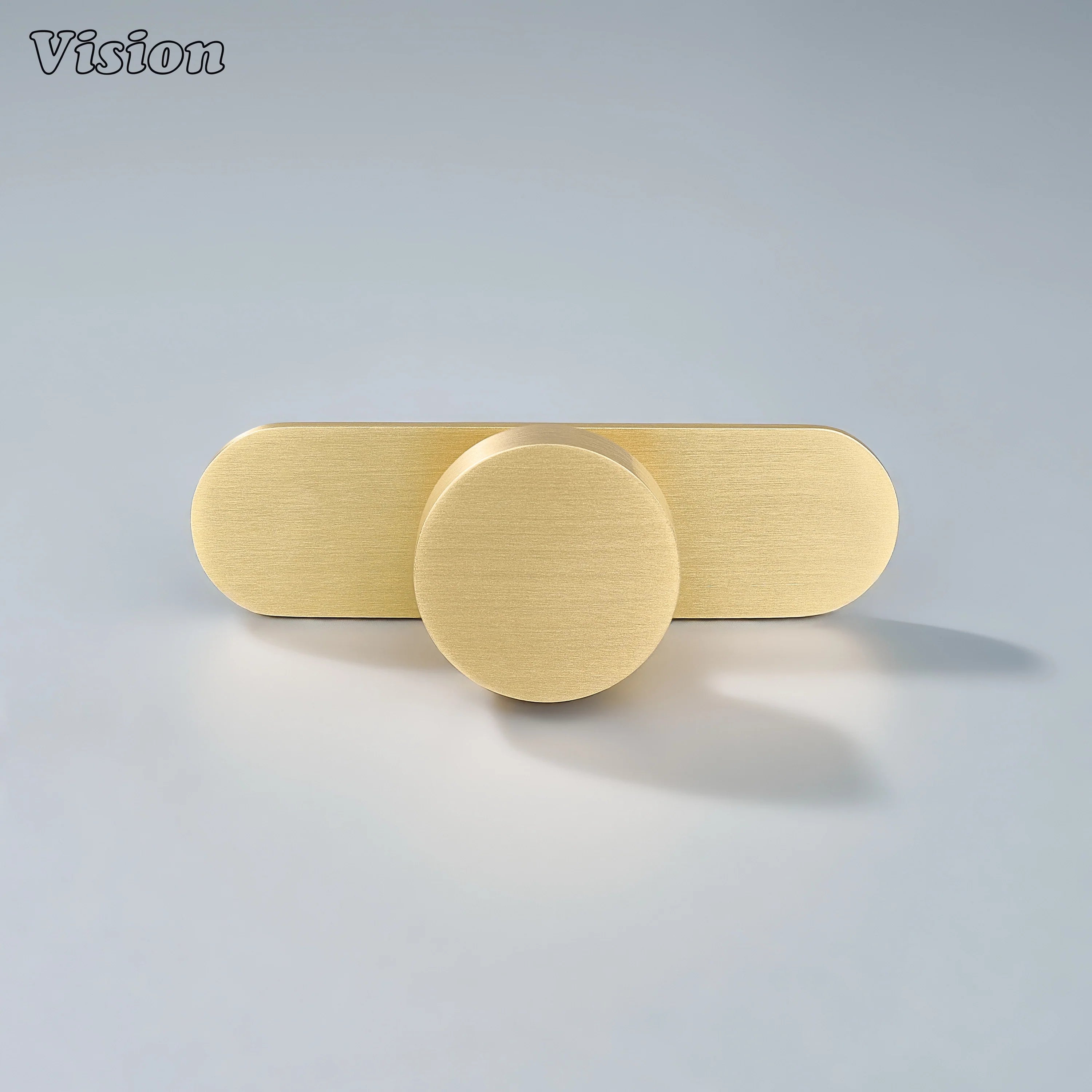 Minimal round cabinet knob in Gold finish mounted on backplate for storage cabinets