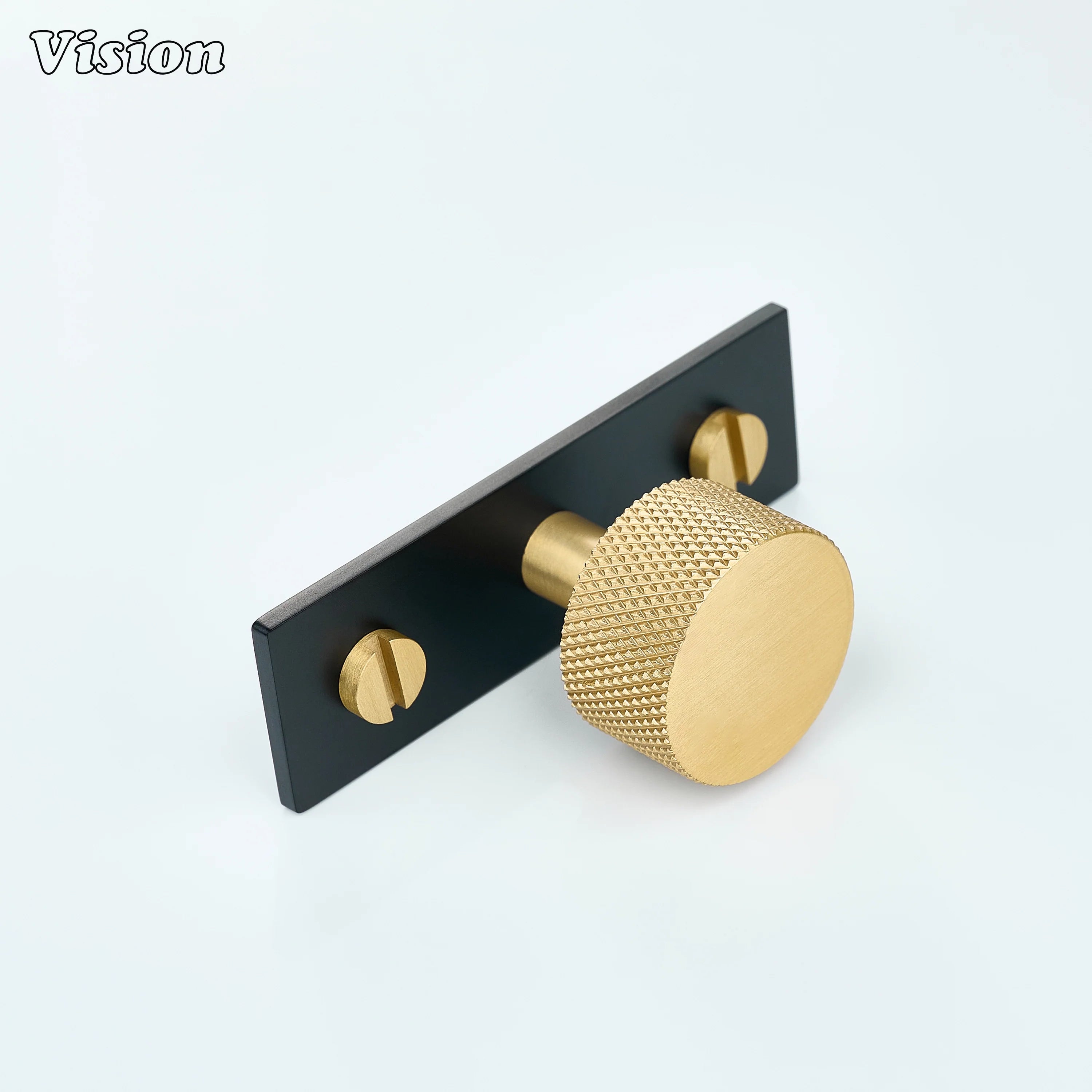 Gold and Black round knurled cabinet knob on rectangular backplate for wardrobe furniture