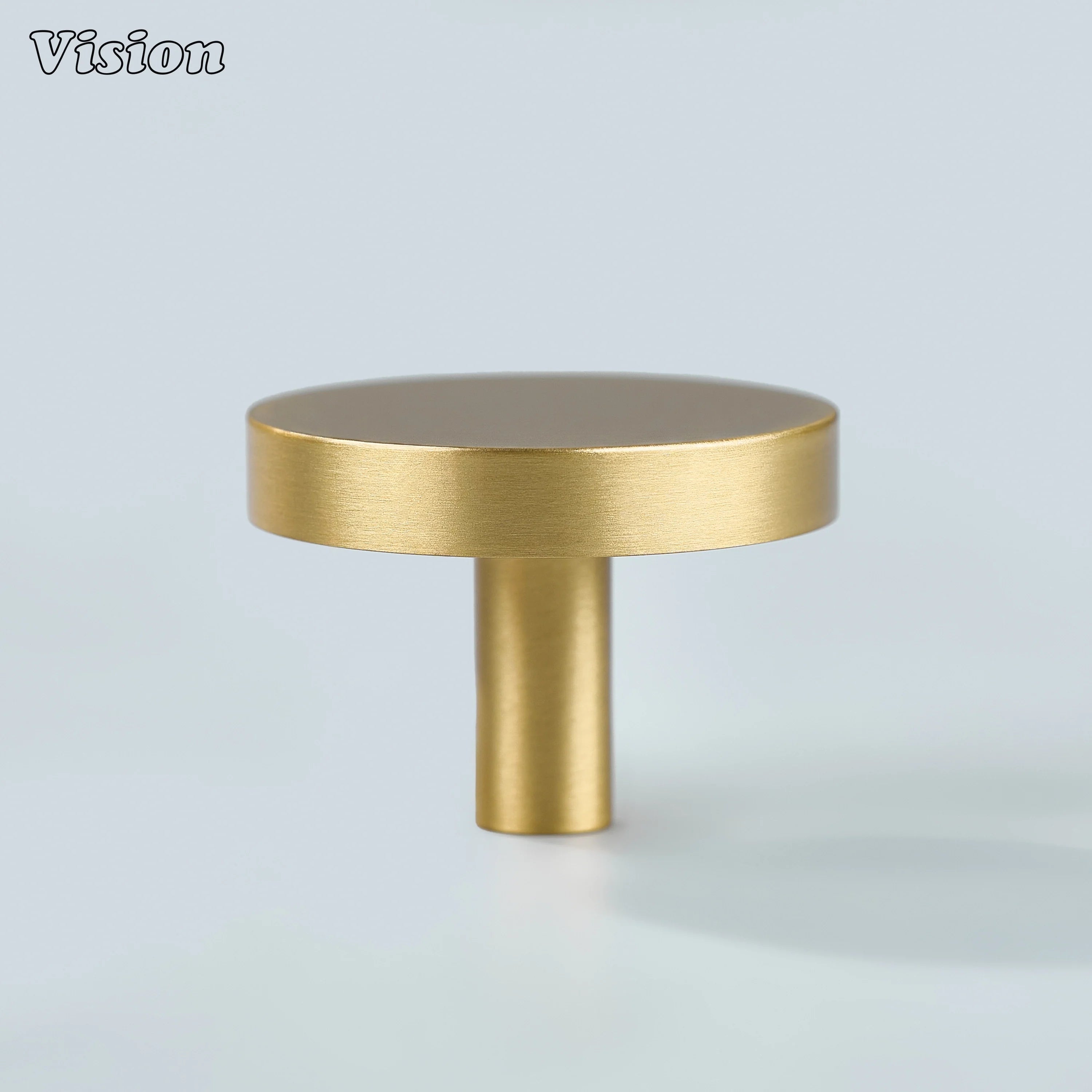 Gold round cabinet knob in solid brass with smooth surface and cylinder leg for wardrobe doors