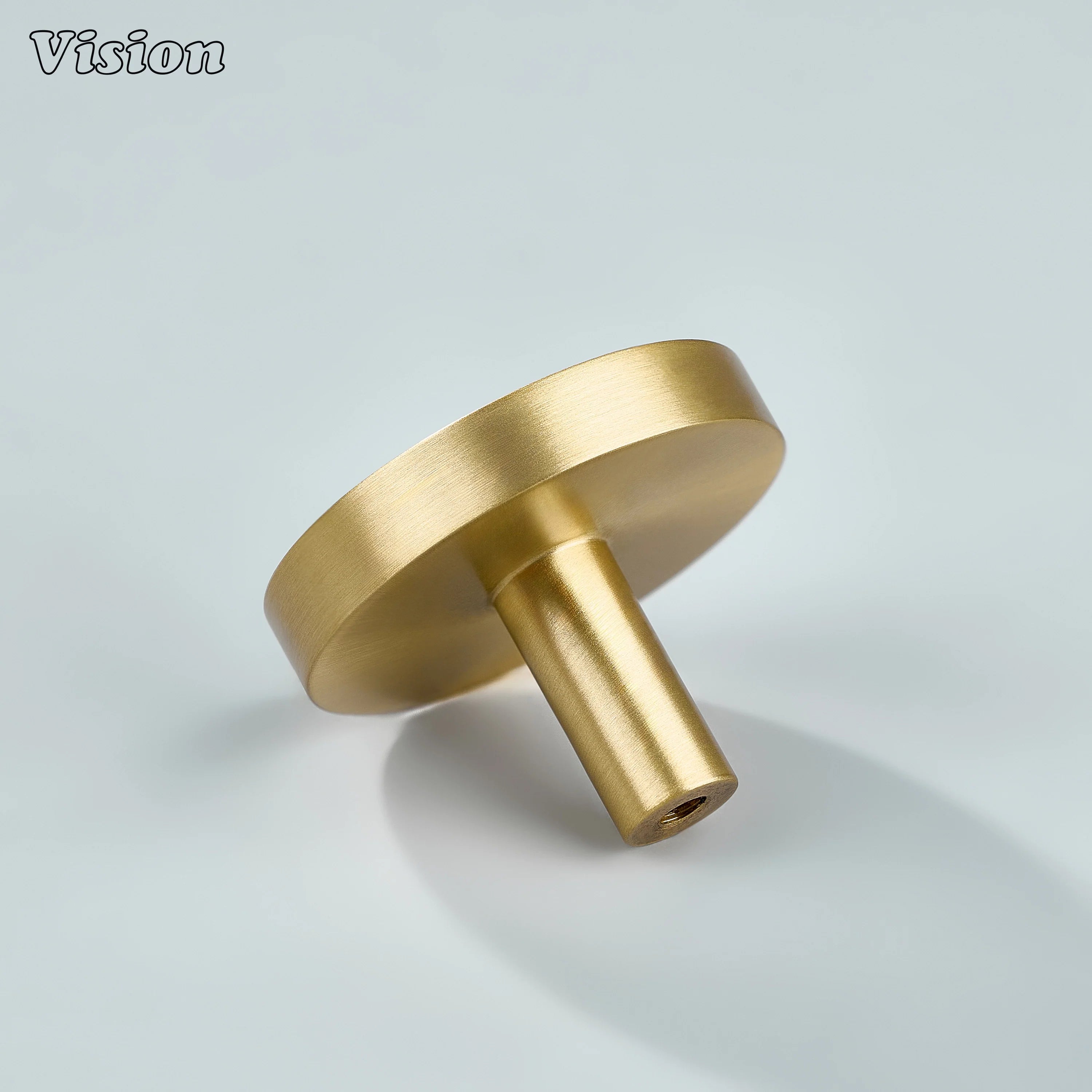 Gold plain round cabinet knob with flat head and sturdy stem for drawer fronts