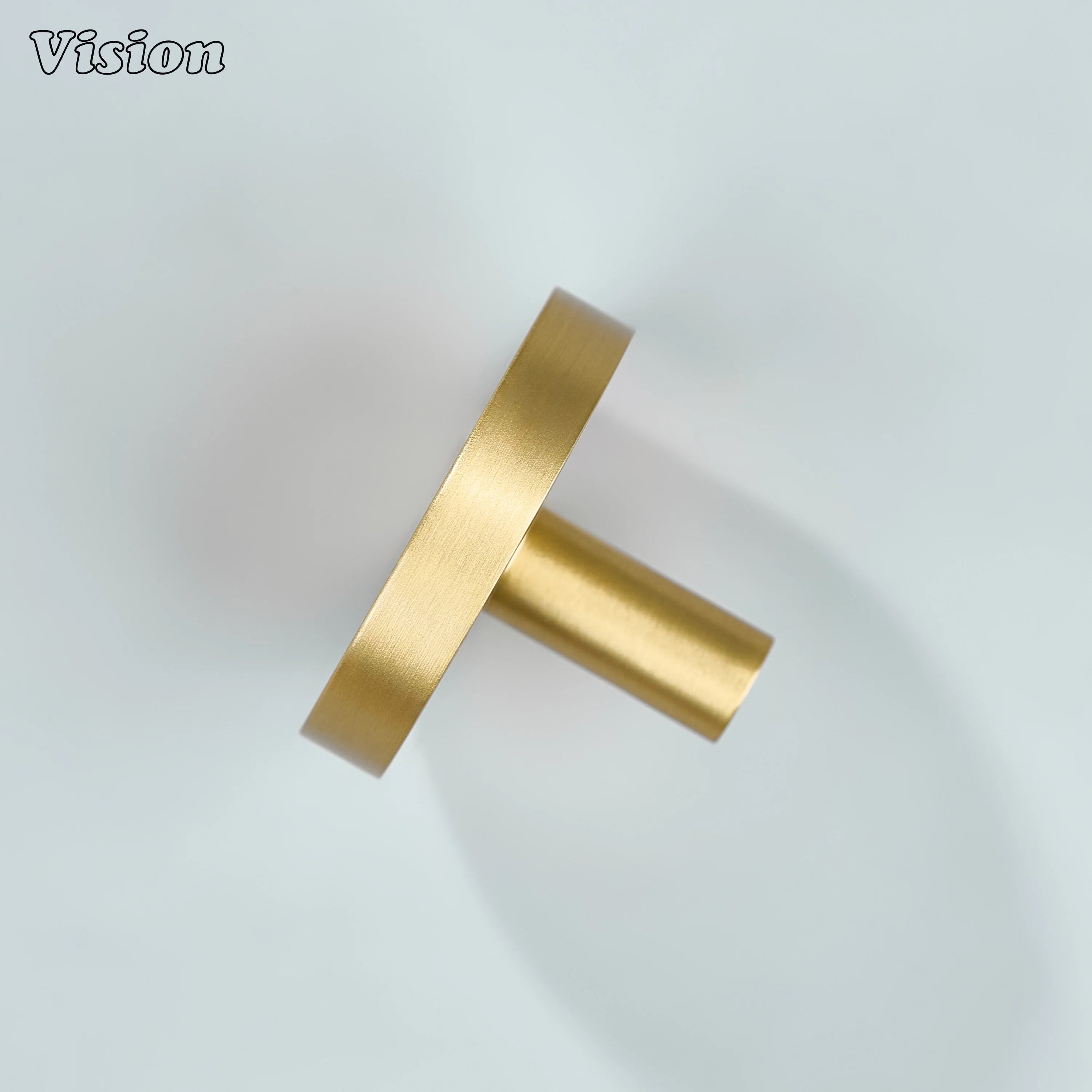 Gold round profile cabinet knob with cylindrical base for kitchen drawers