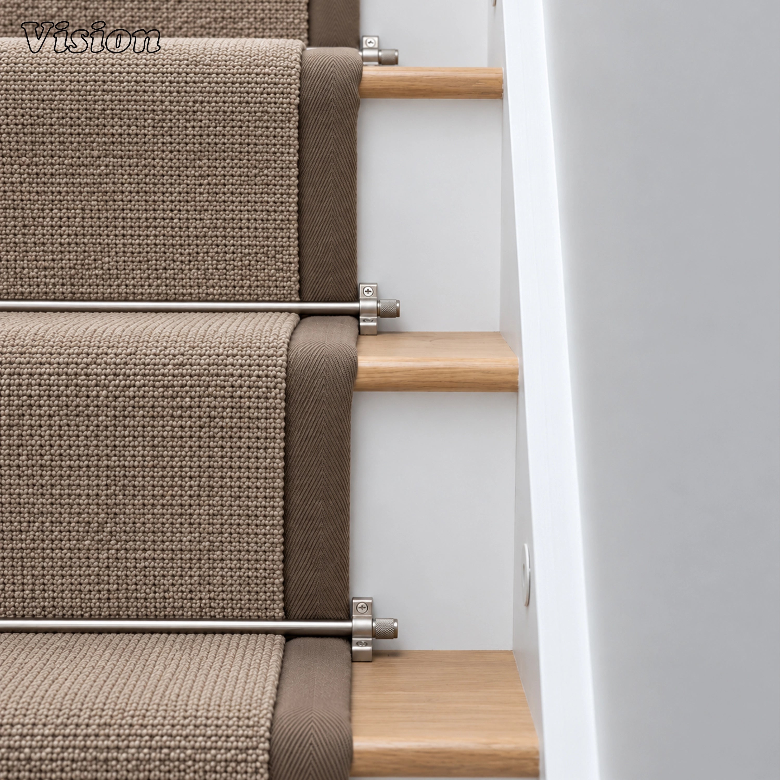 Architectural silver stair carpet rod featuring knurled end caps on luxury residential stairs