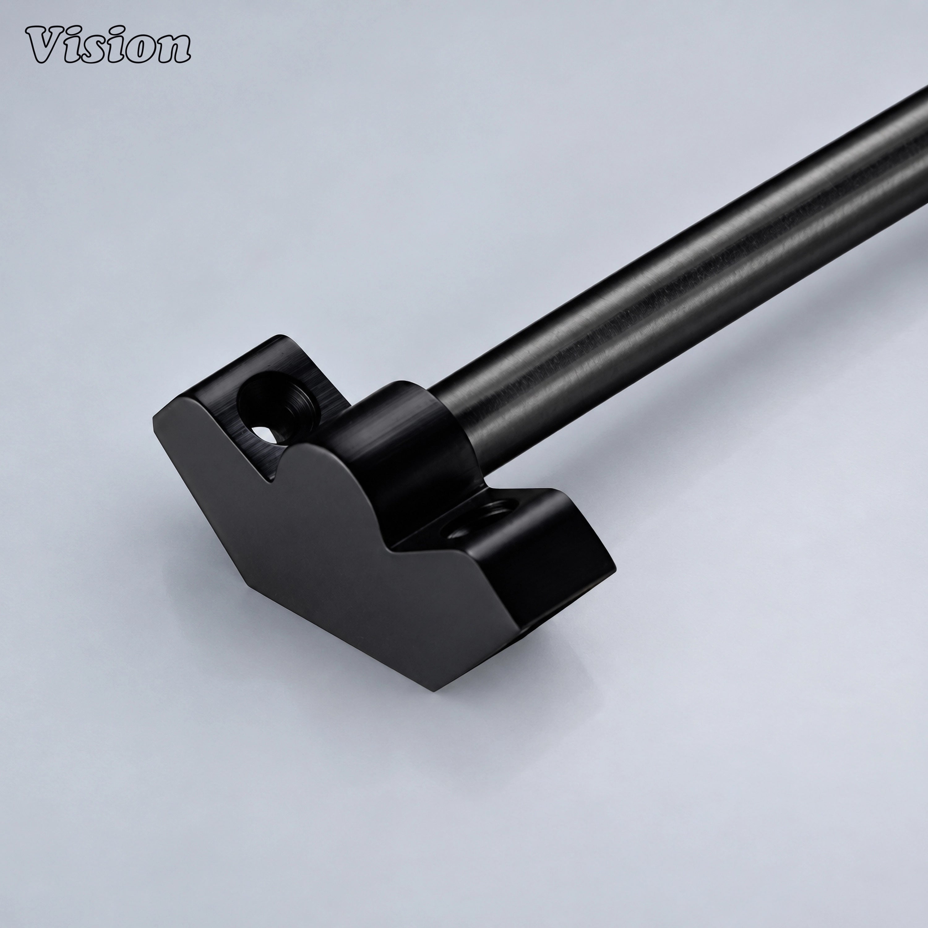 Black plain stair rod runner with smooth hollow bar and sleek finials on carpeted stairs