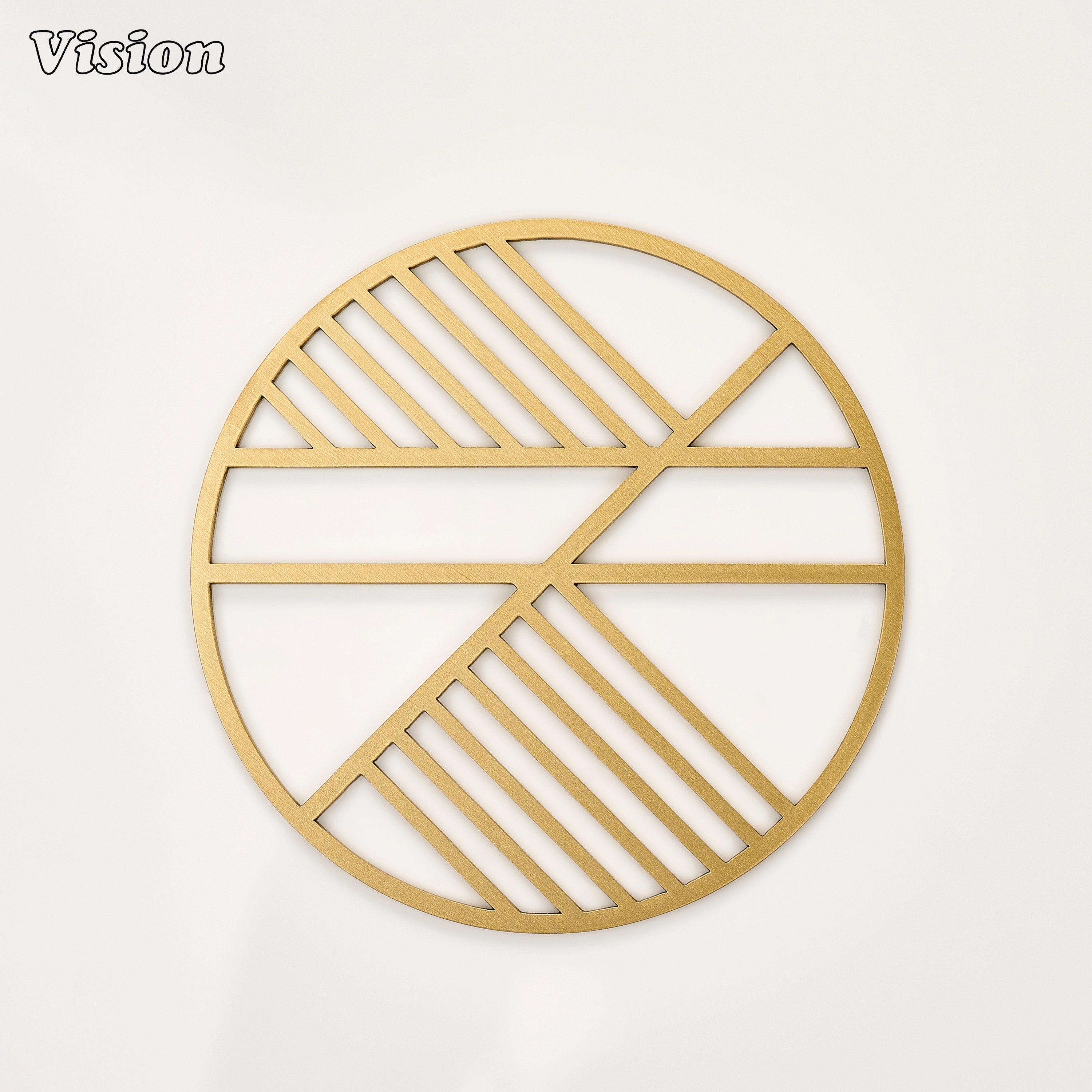 Gold solid brass round coaster with precision-cut intersecting lines on a modern dining table